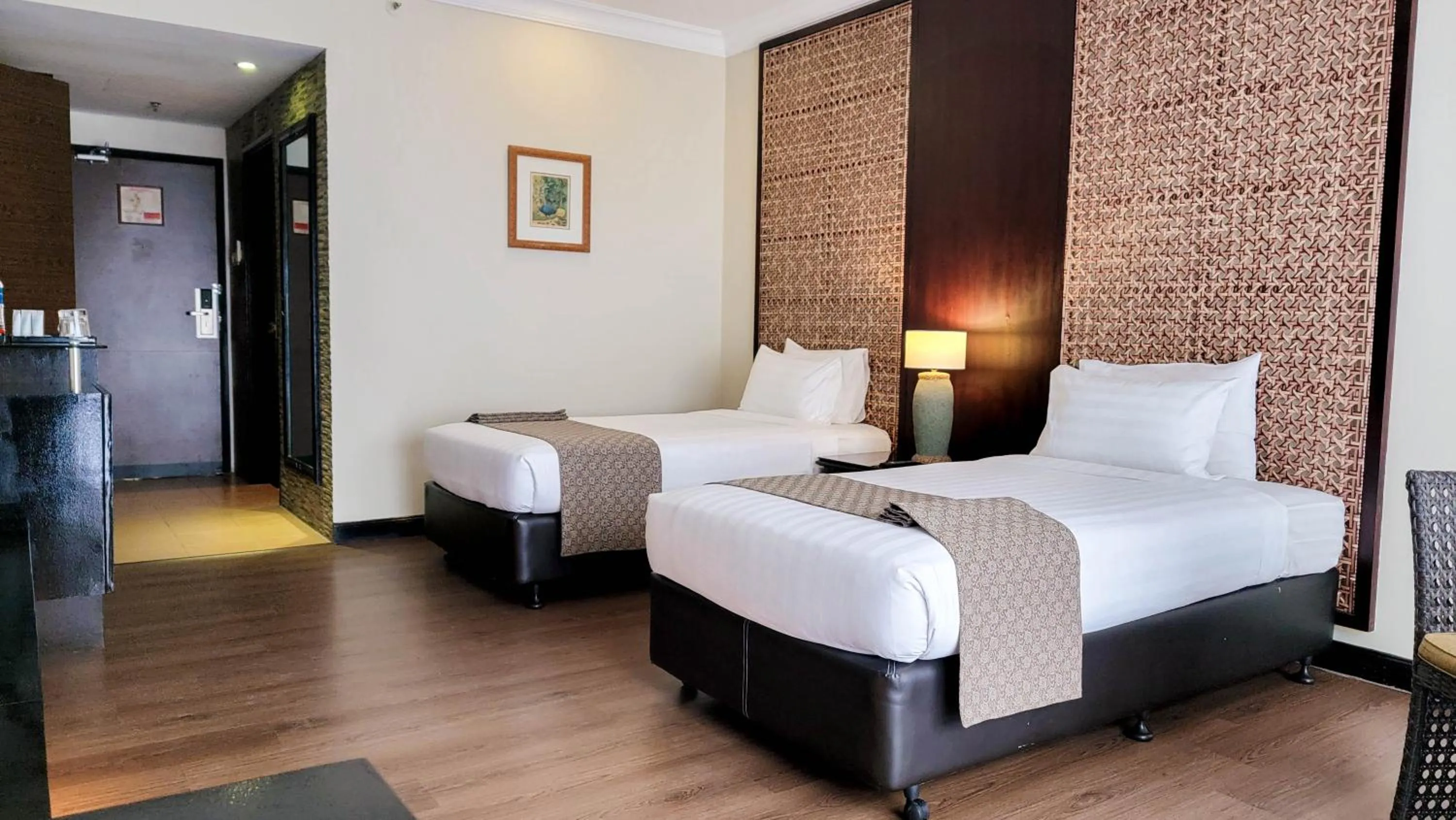 Bed in Mines Beach Resort Hotel