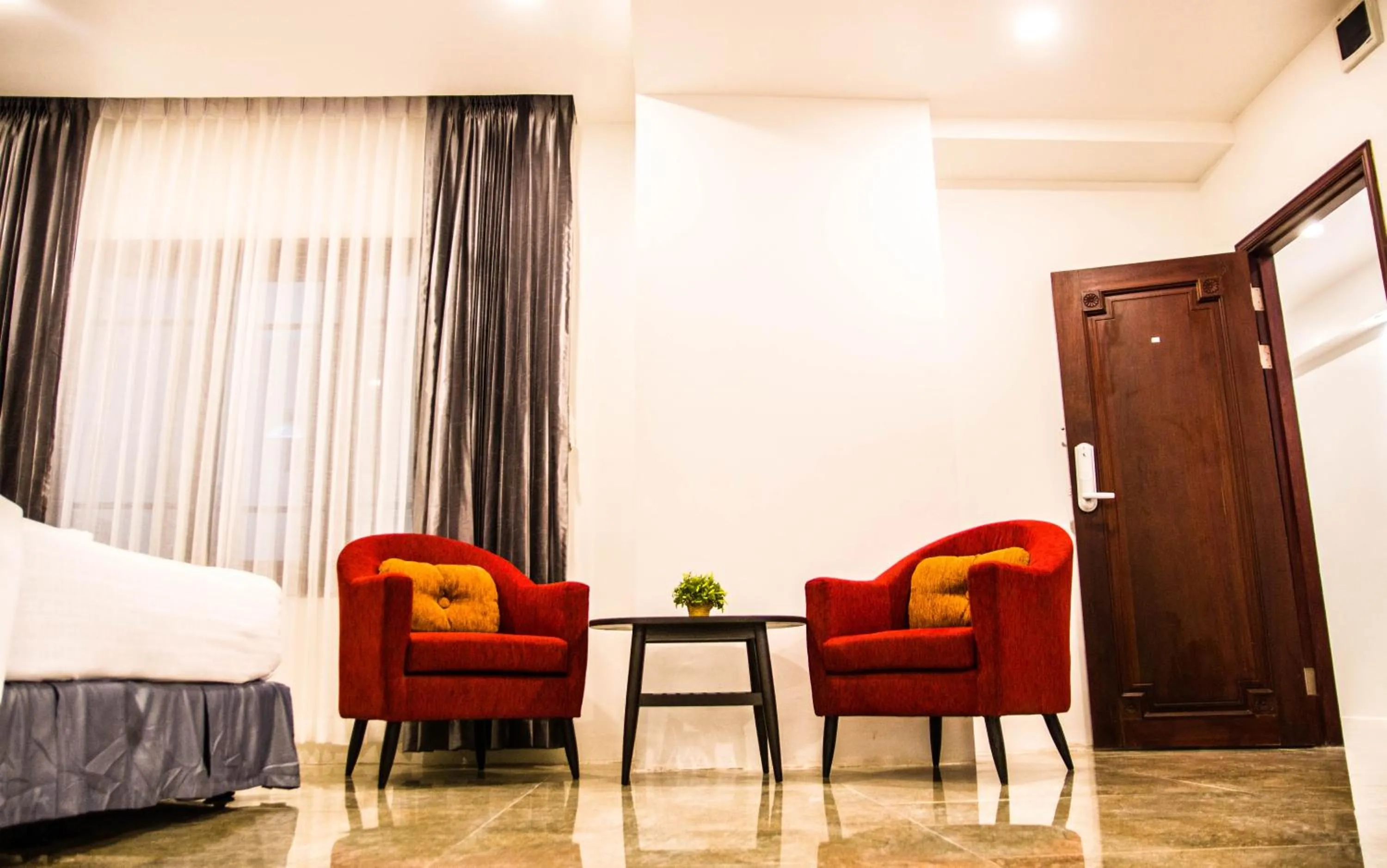 Seating area, Bed in Family Boutique Hotel