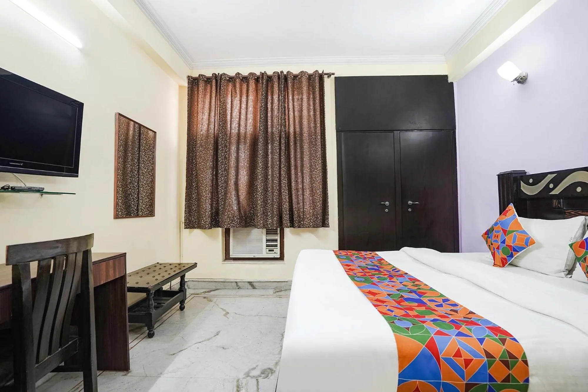 Bed in FabHotel Ivy Inn Sector 35