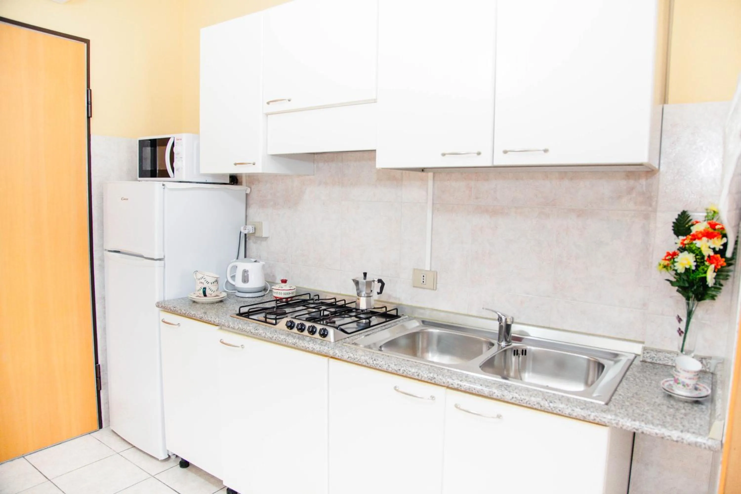 Kitchen or kitchenette in Casa Vacanze Cau