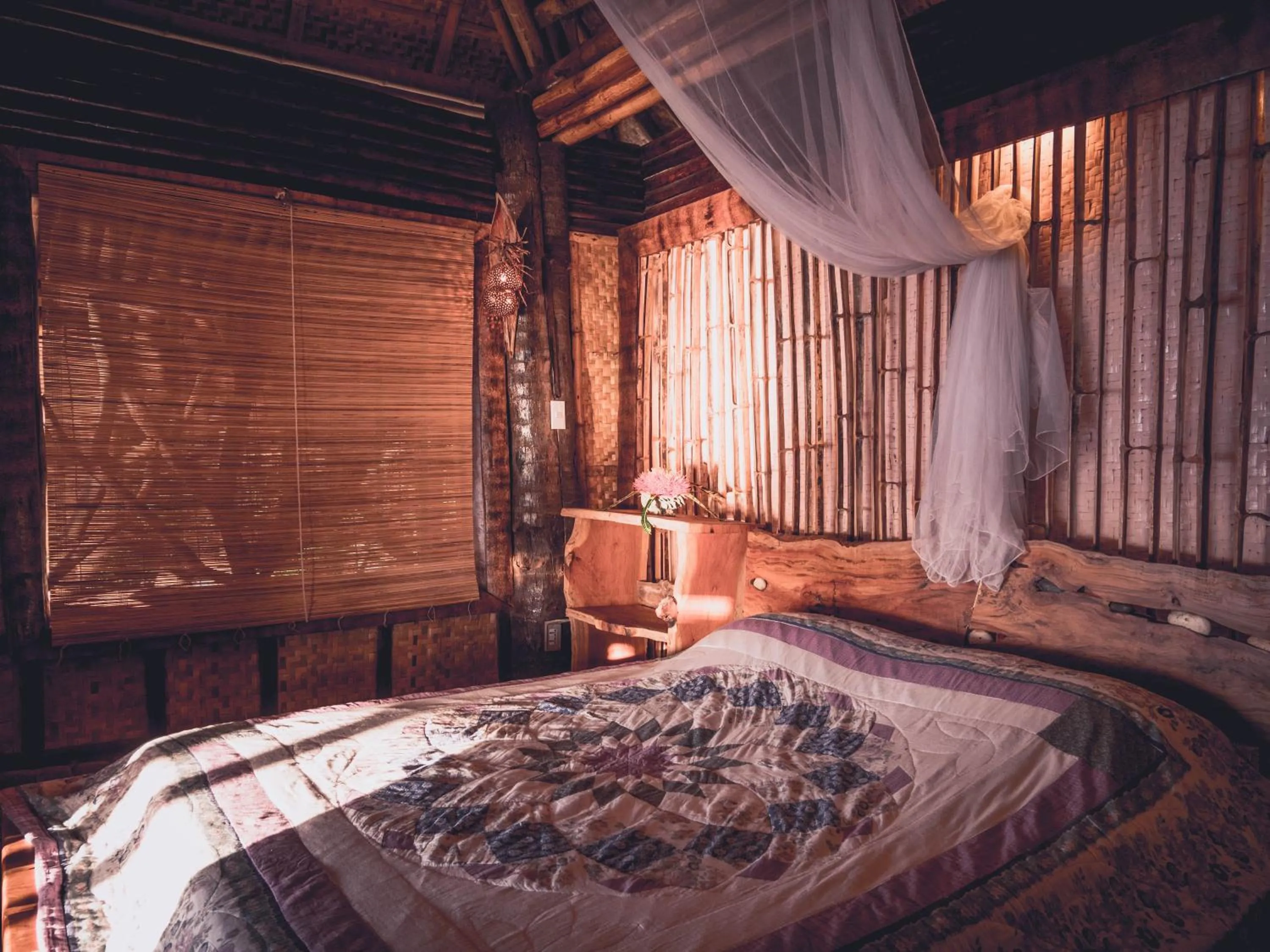 Bed in Nature's Eye Resort