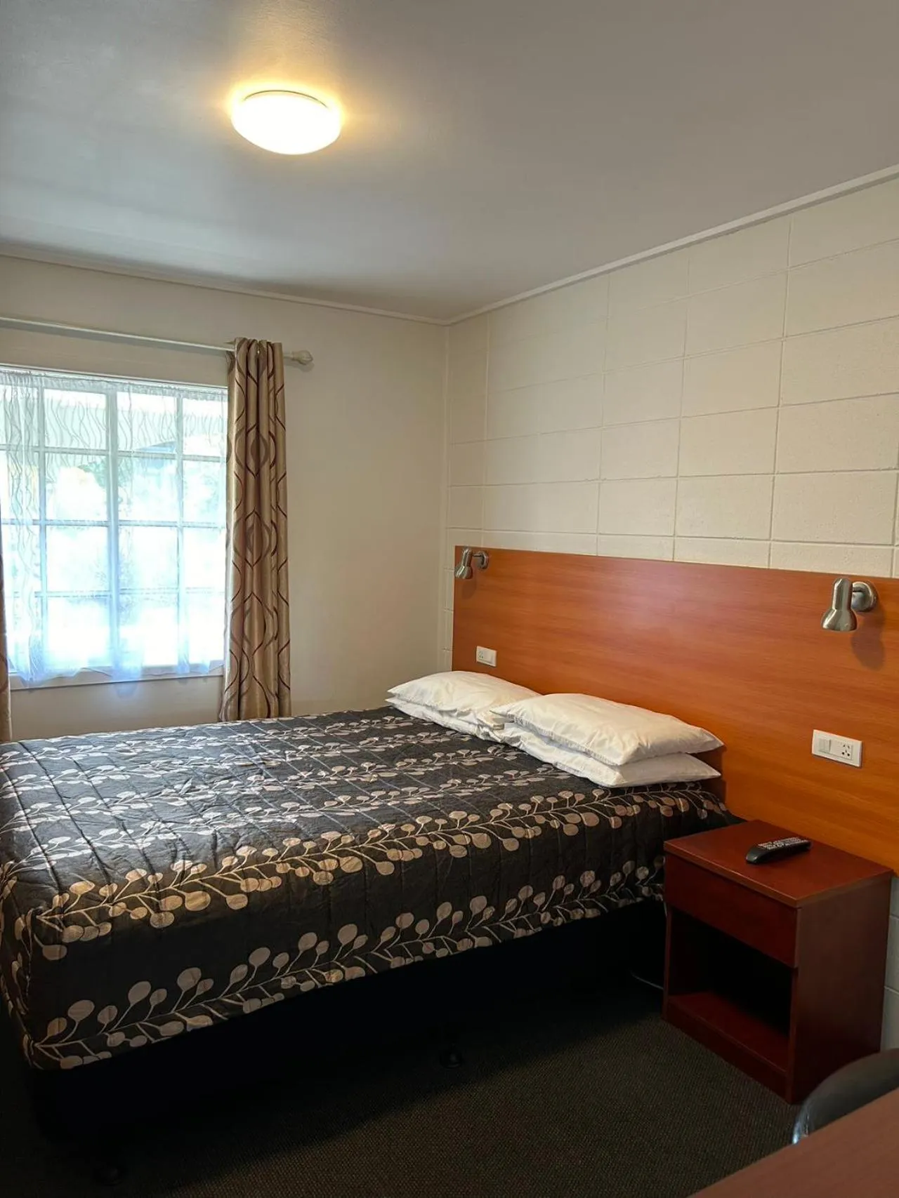 Bed in Tudor Motor Lodge