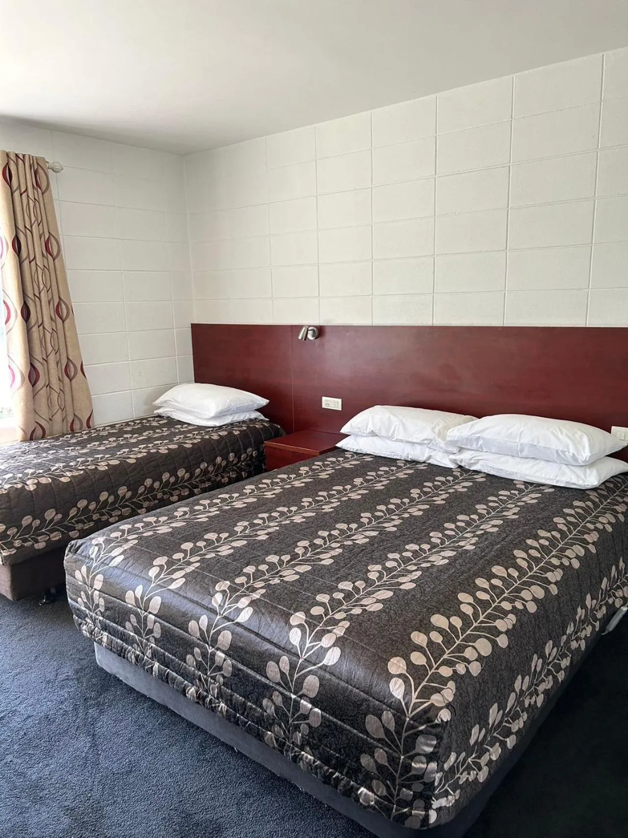 Bed in Tudor Motor Lodge