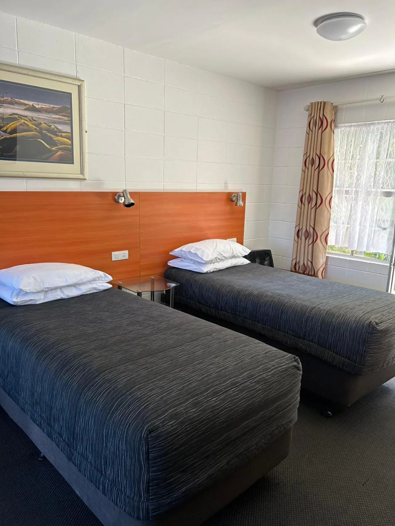 Bed in Tudor Motor Lodge