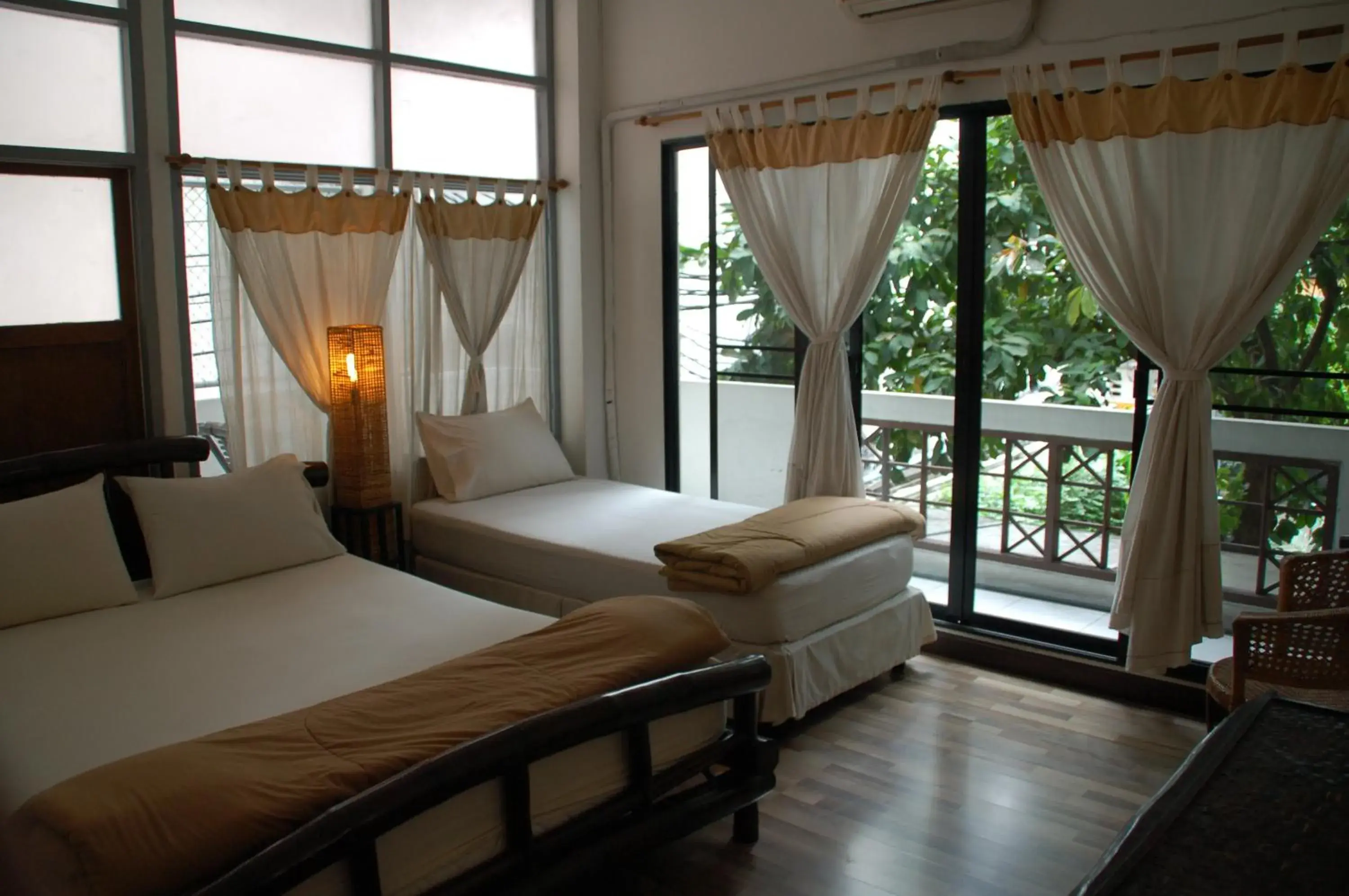 Triple Room with Balcony in Lamphuhouse Bangkok Triple Room with Balcony in Lamphuhouse Bangkok