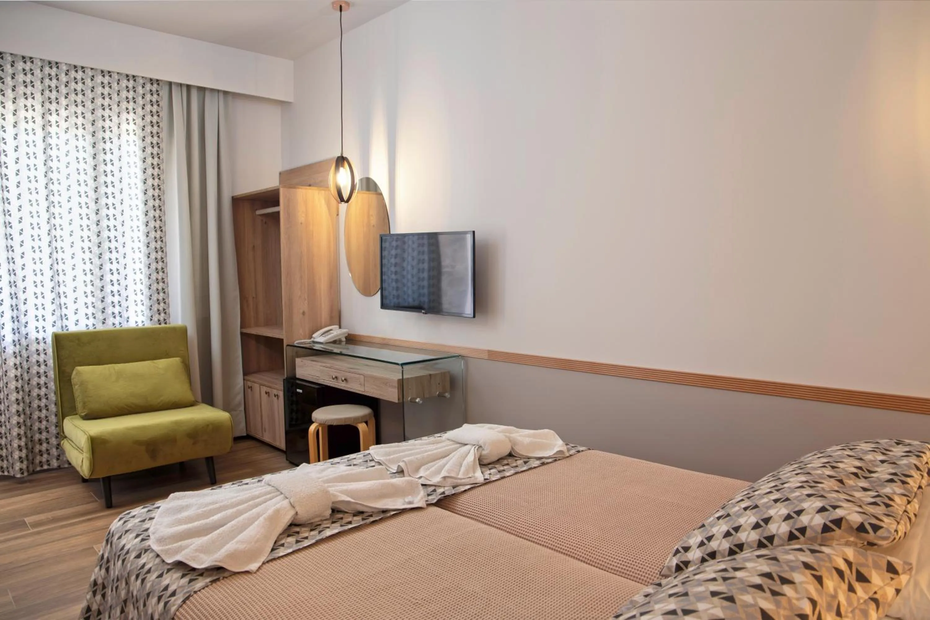 Seating area, Bed in Kalimera Andros