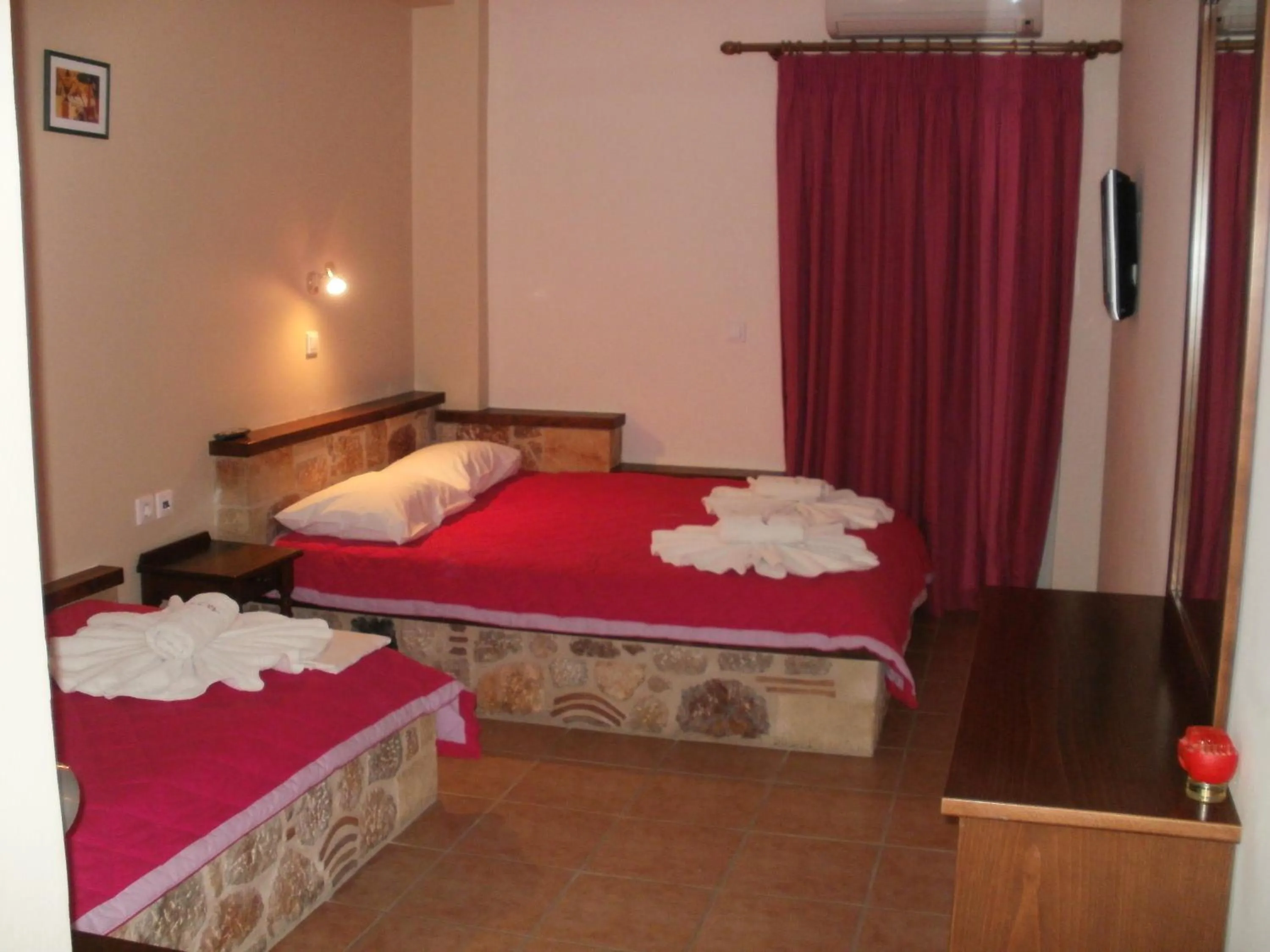 Bed in Aktaion Hotel