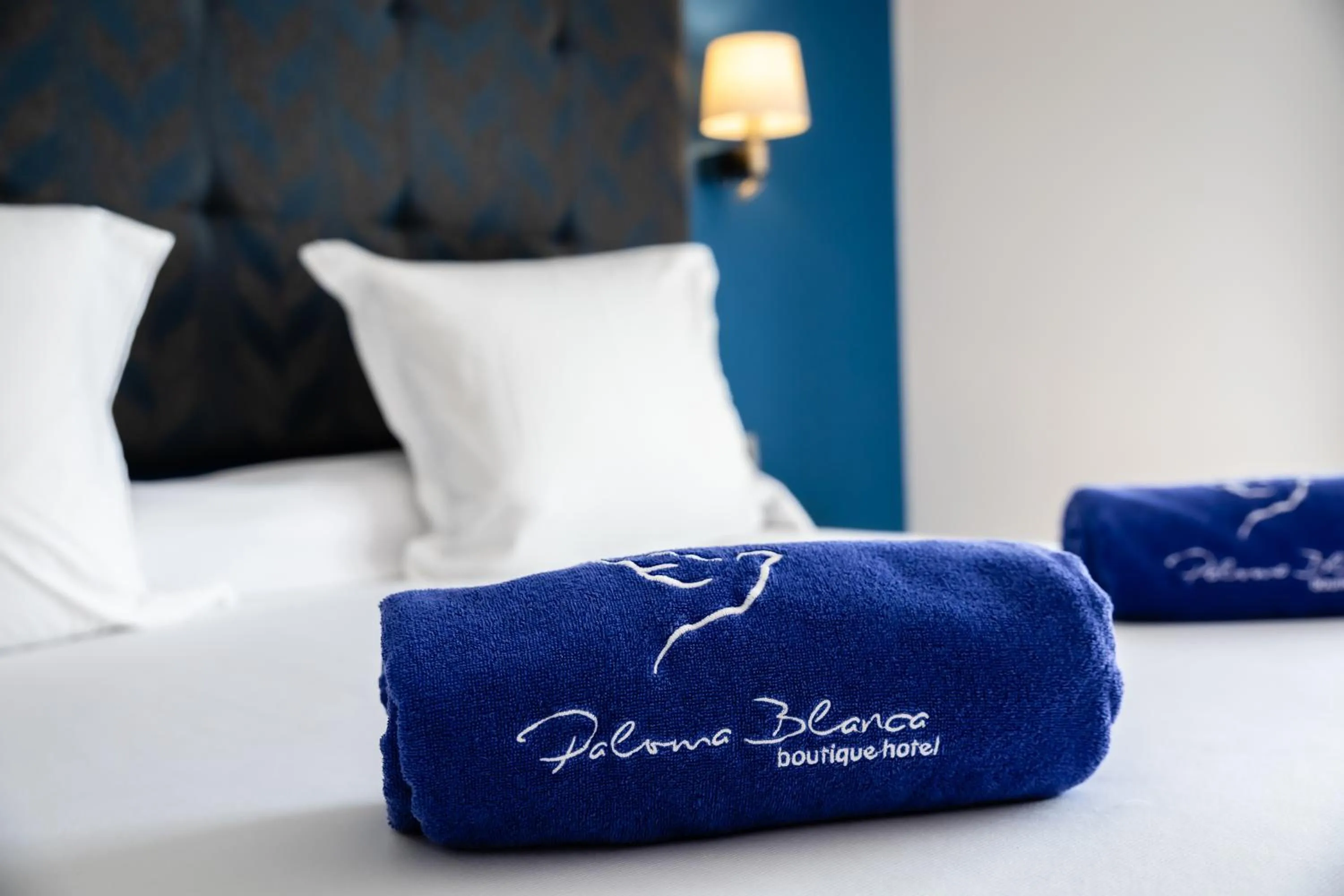 Bed in Paloma Blanca Boutique Hotel