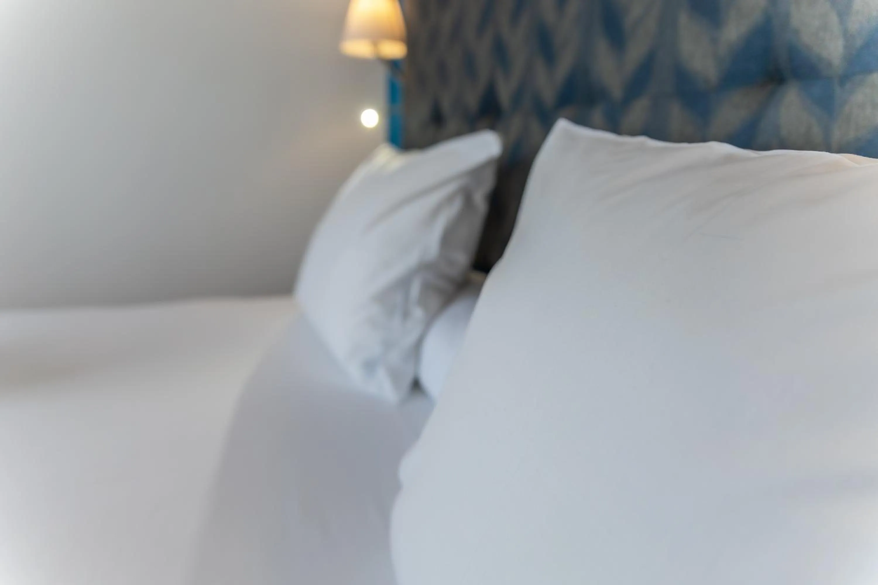 Bed in Paloma Blanca Boutique Hotel