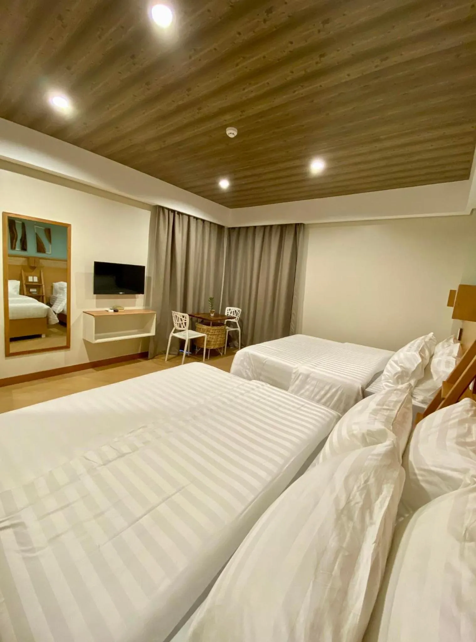 Bed in Acacia Garden Inn and Suites