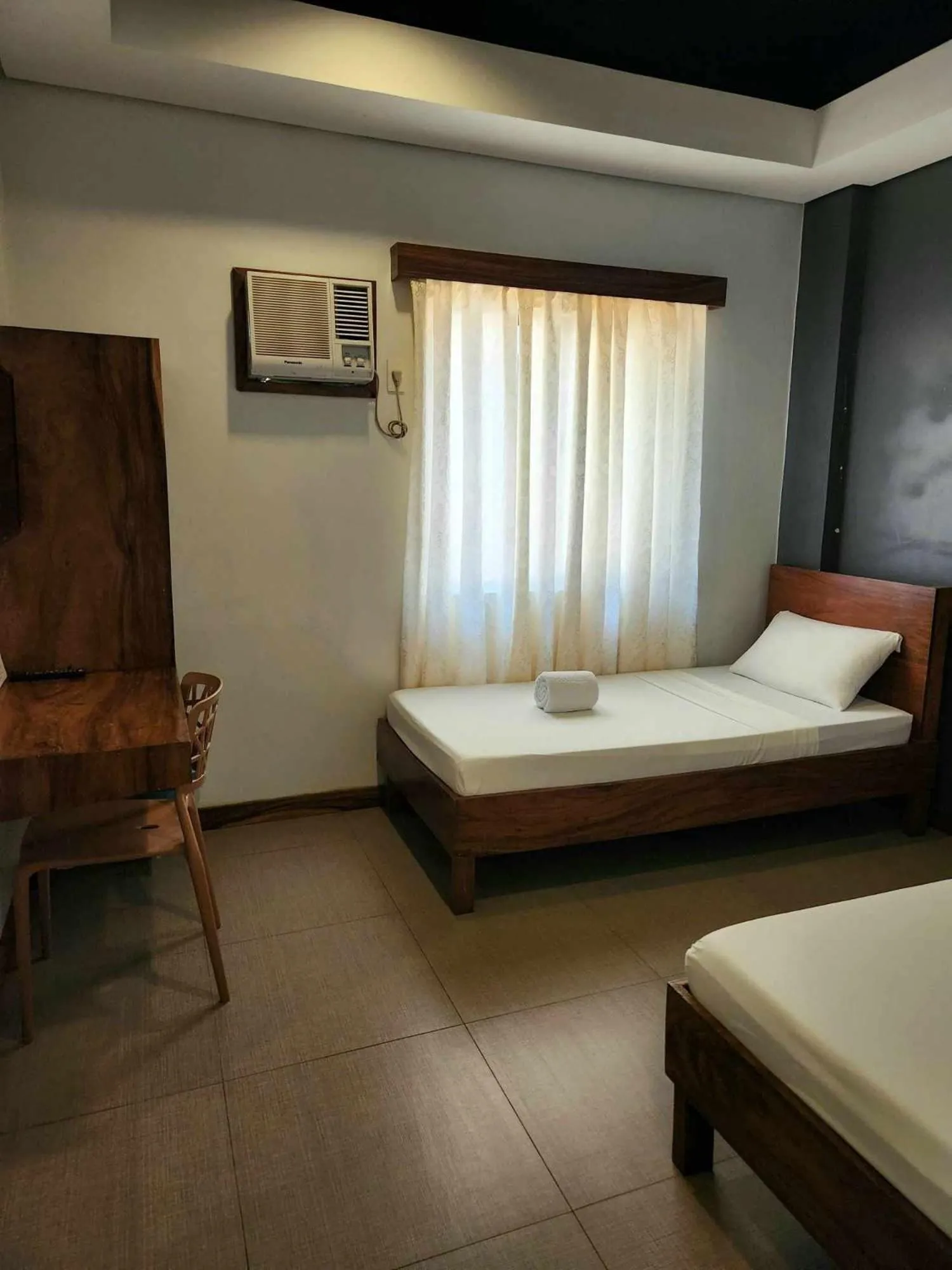 Bed in Acacia Garden Inn and Suites