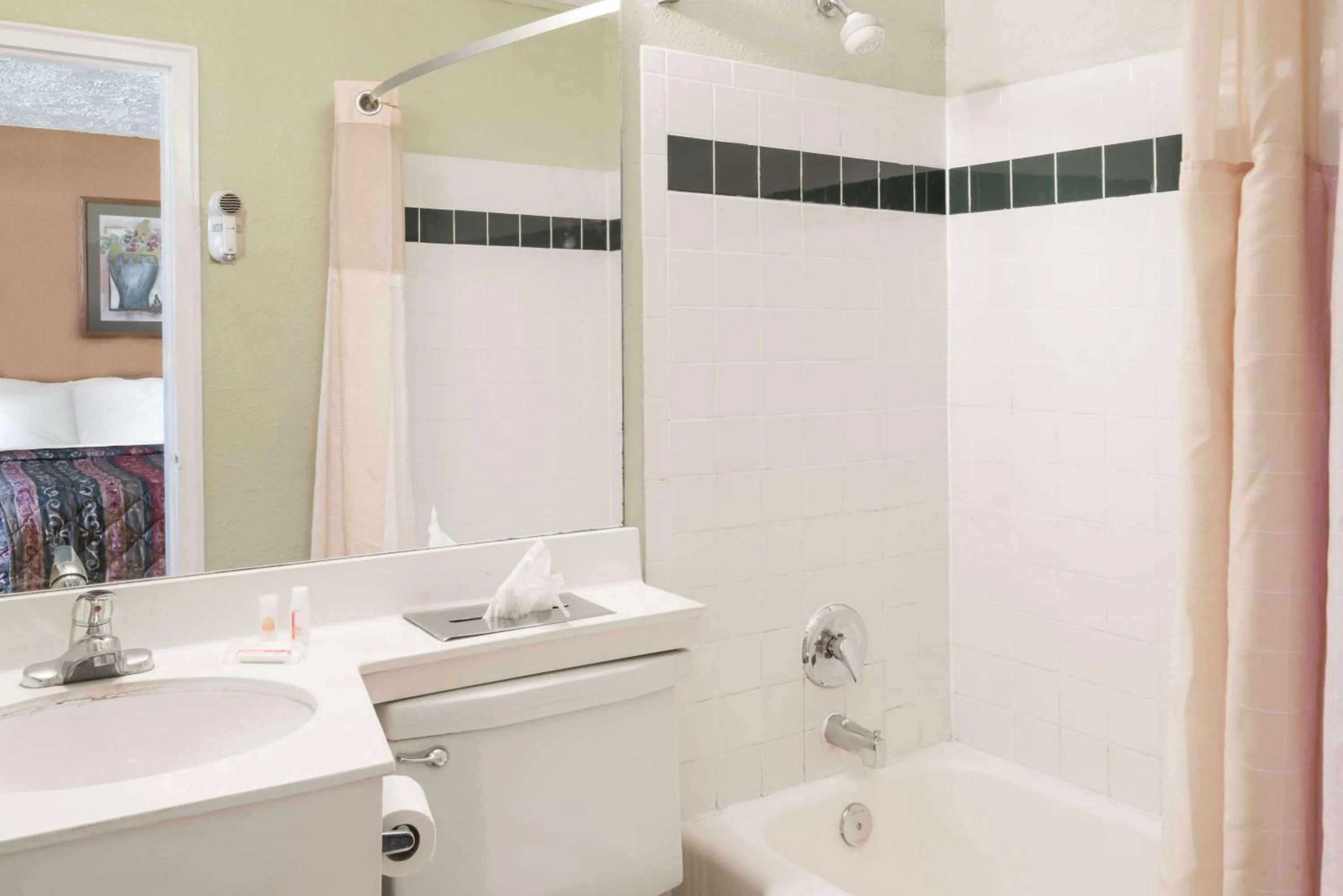 Bathroom in Days Inn by Wyndham Henrietta/Rochester Area