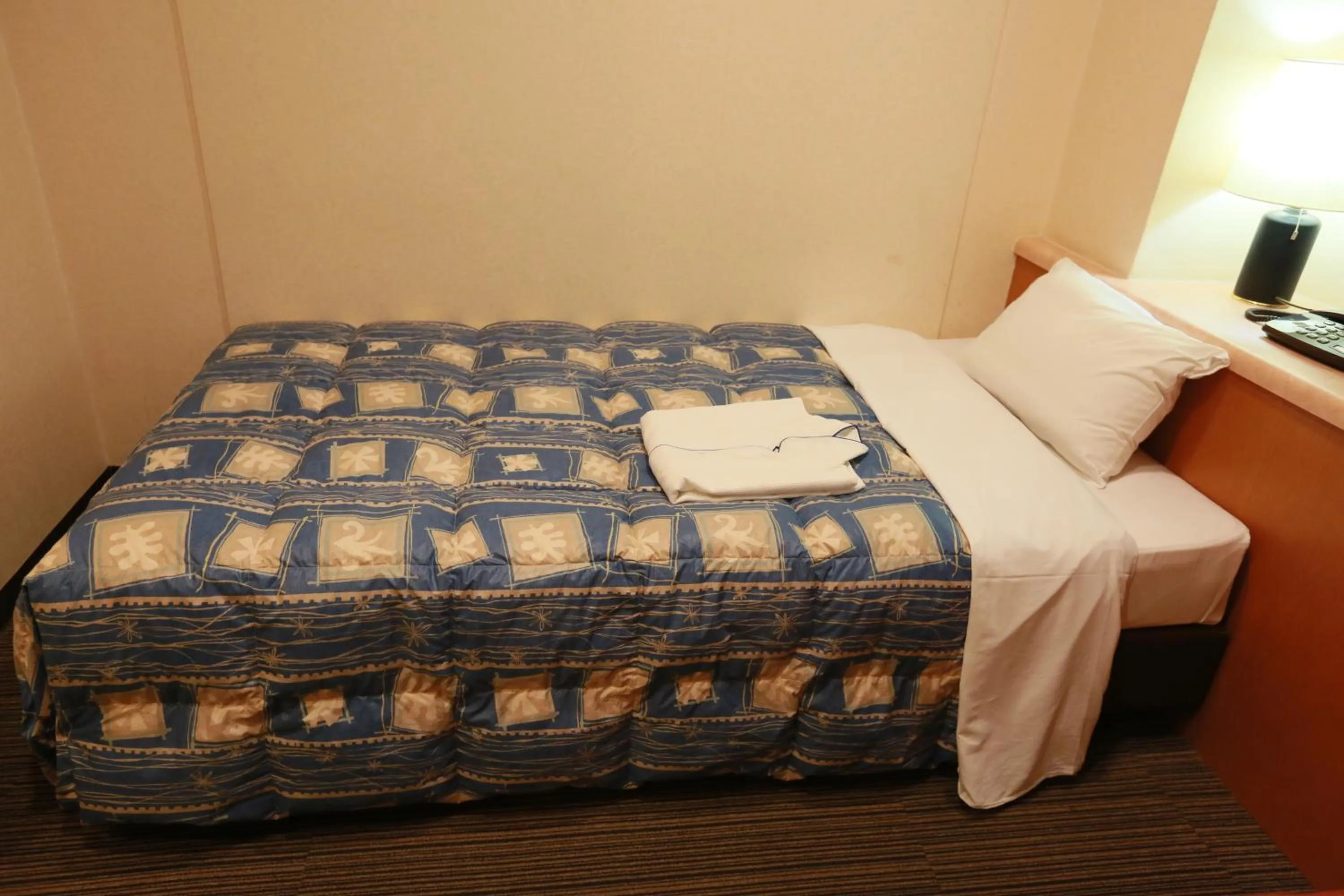 Bed in Hotel Ikeda