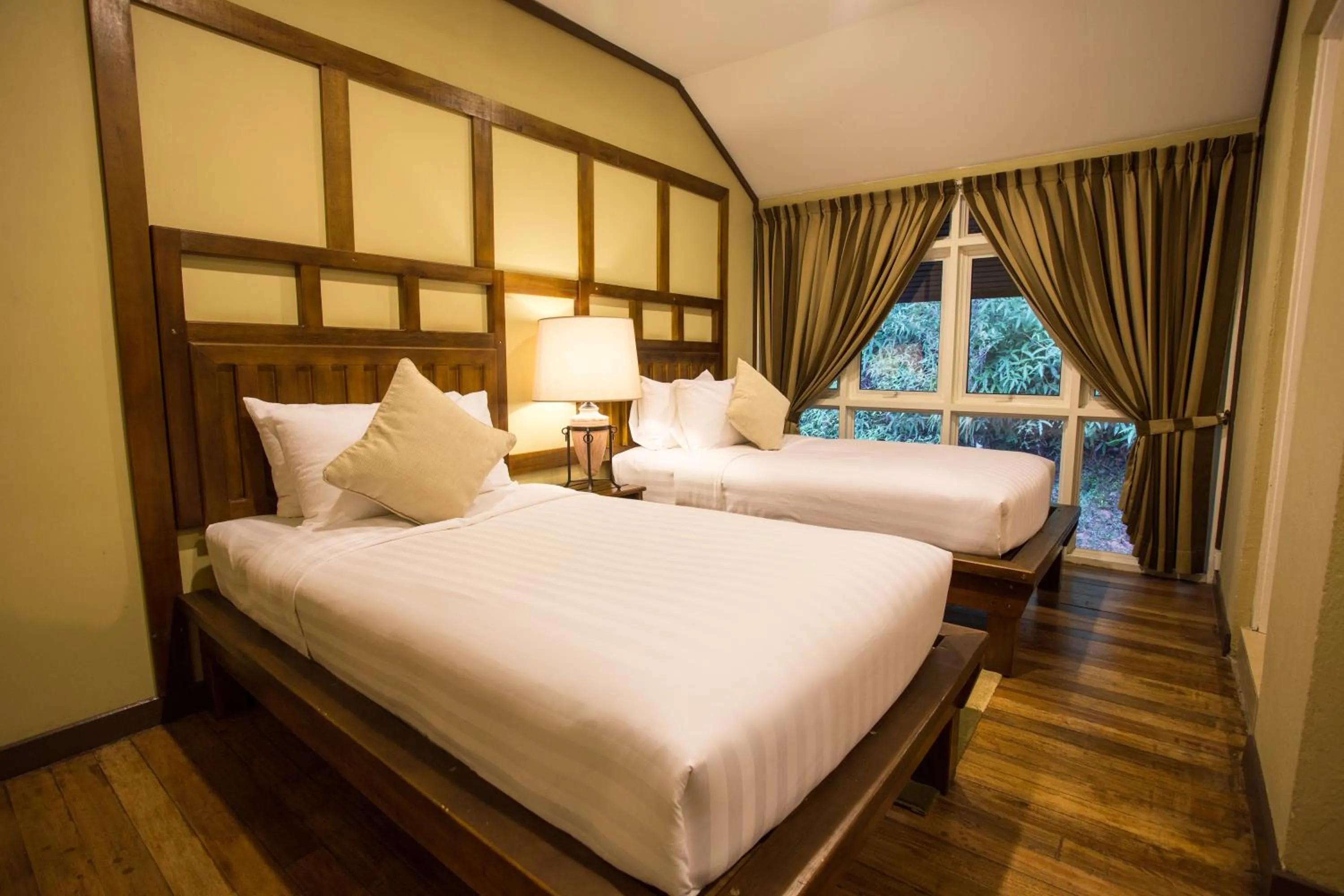 Bed in Sutera Sanctuary Lodges At Kinabalu Park