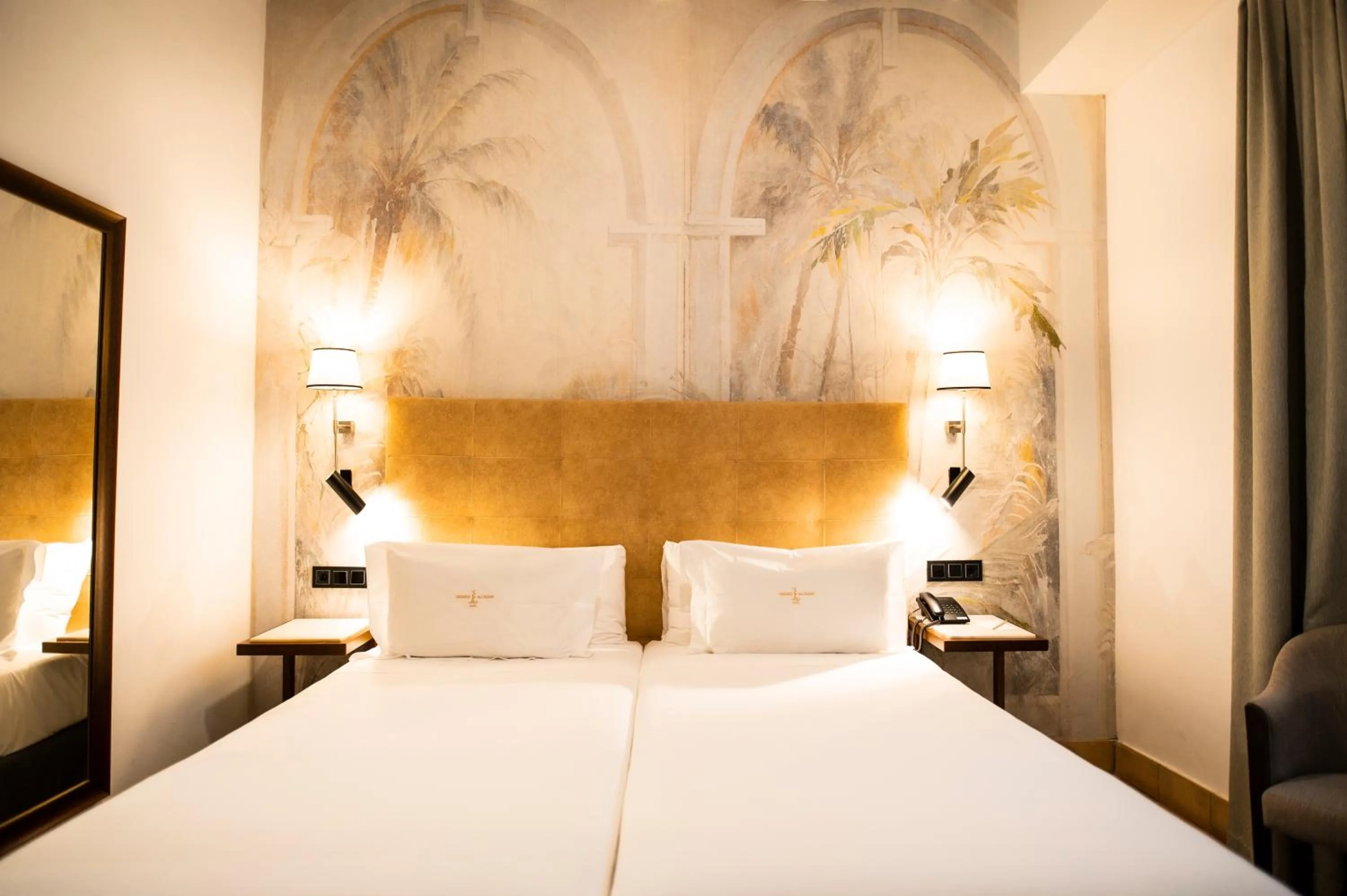 Bed in Legado Alcazar Hotel