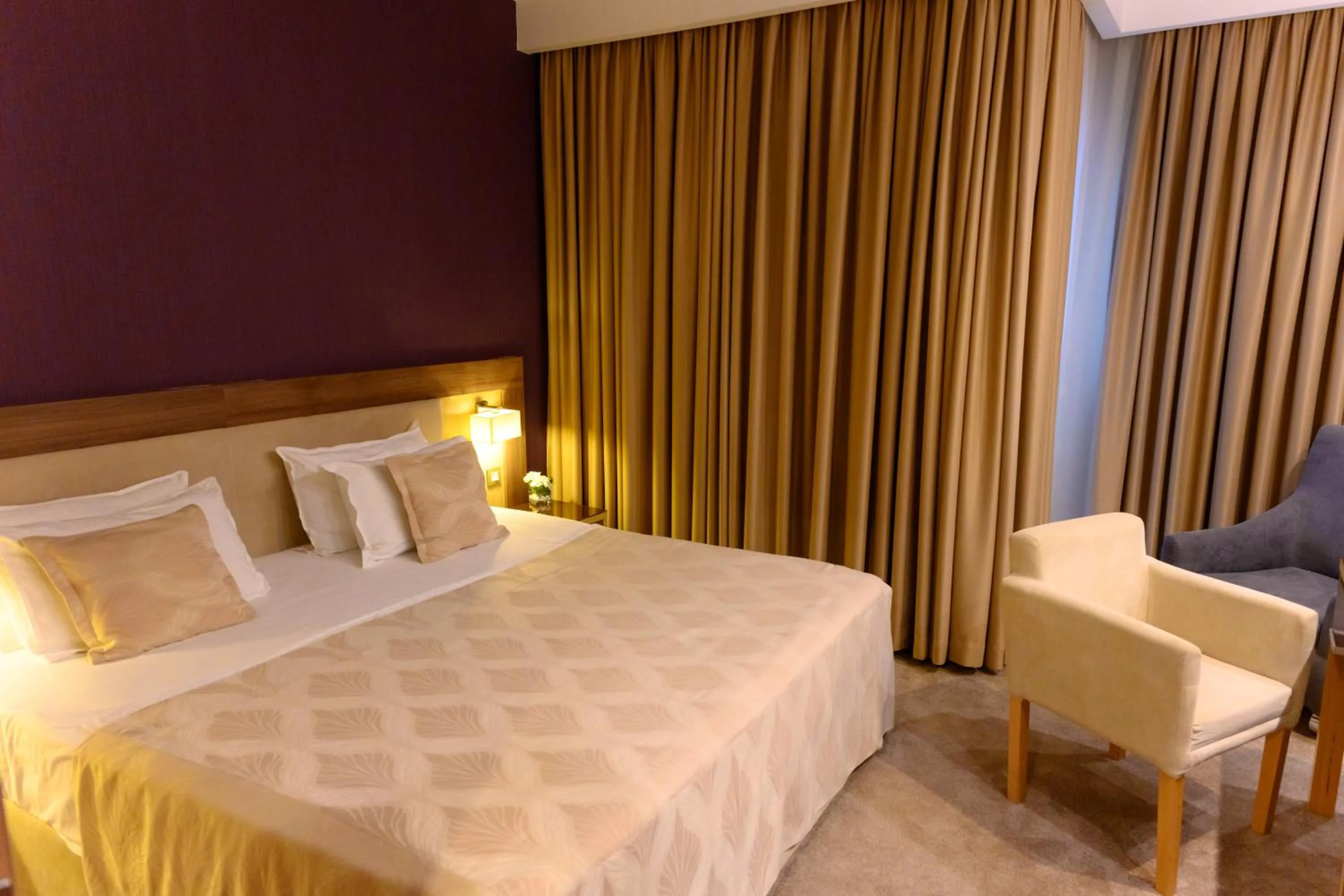 Bed in Hotel Tami Residence