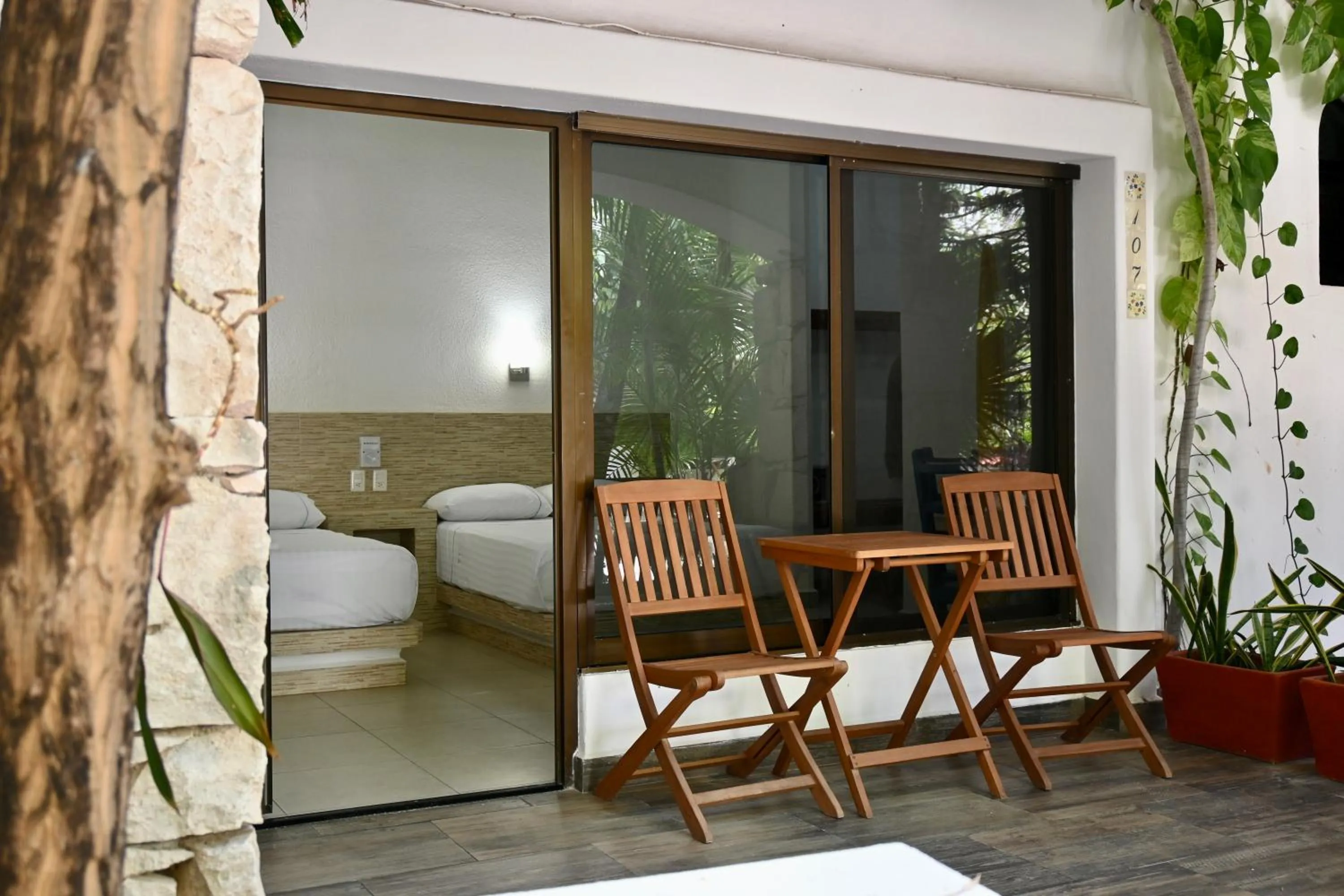 Bed in Pelicano Inn Playa del Carmen - Beachfront Hotel