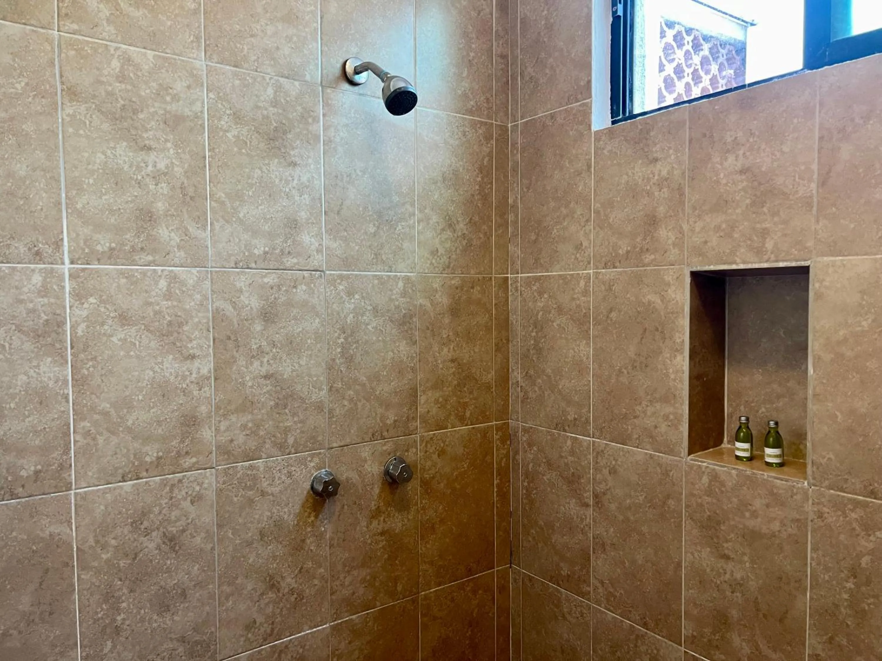 Shower in Pelicano Inn Playa del Carmen - Beachfront Hotel