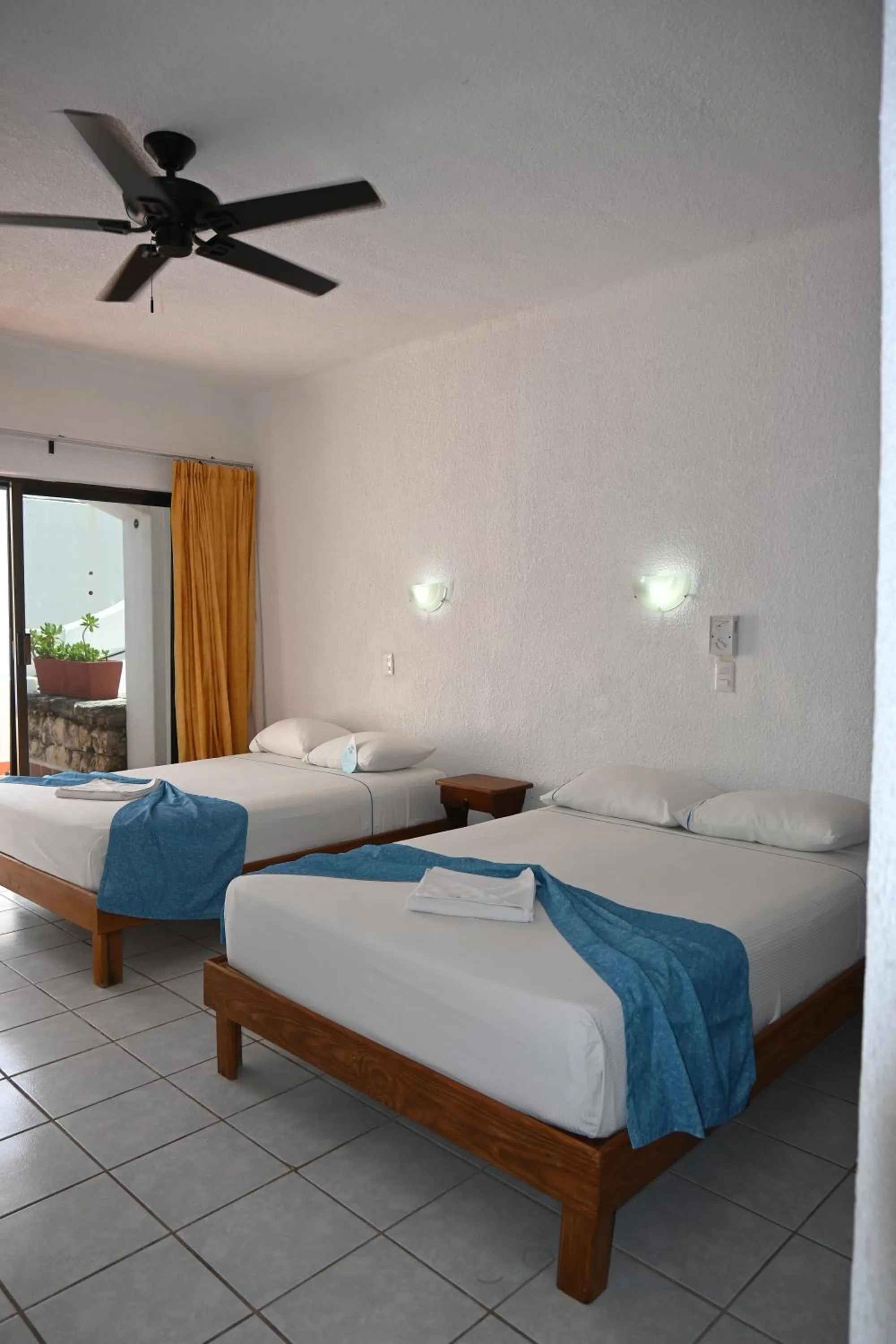 Bed in Pelicano Inn Playa del Carmen - Beachfront Hotel