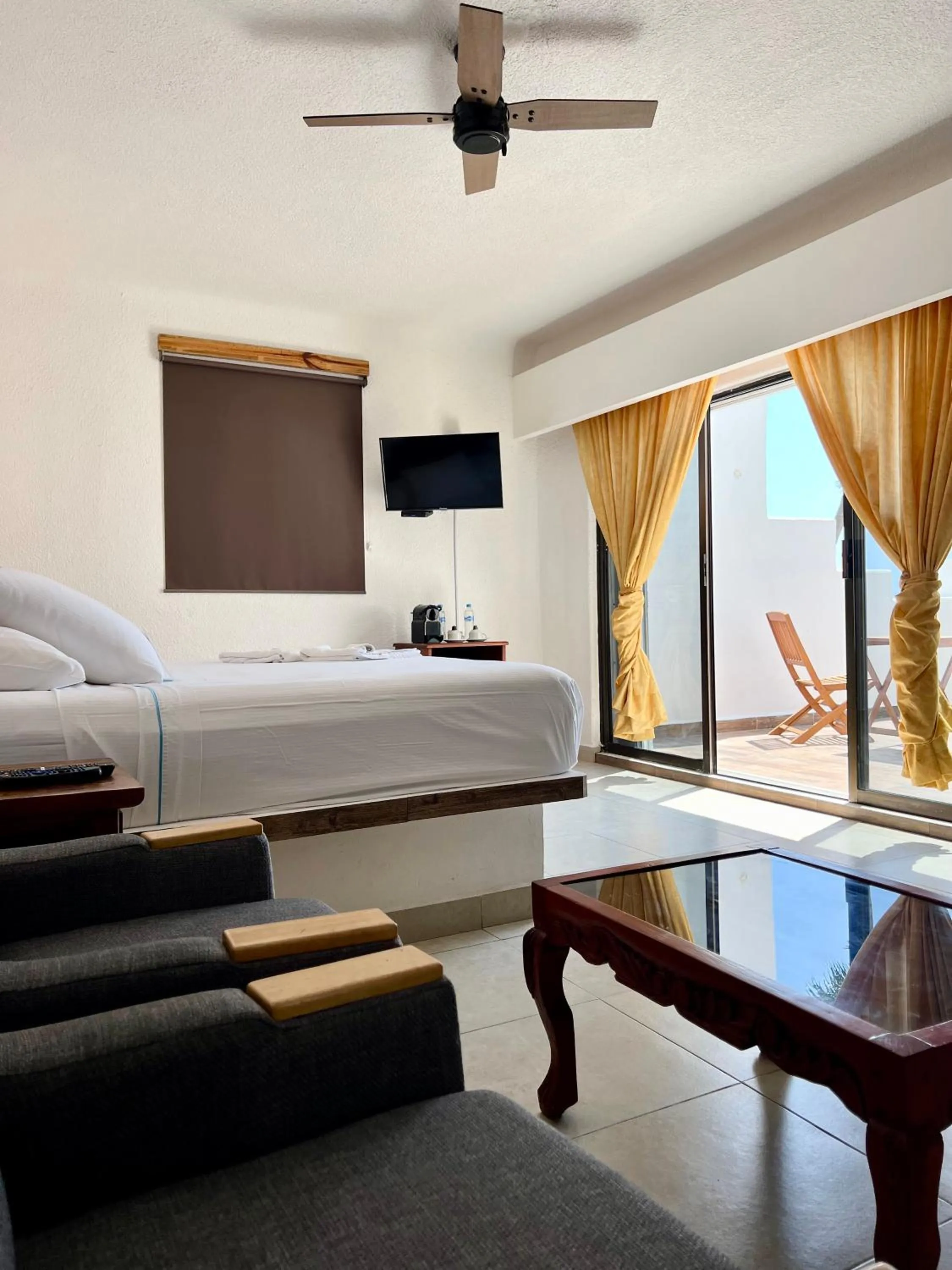 Bed in Pelicano Inn Playa del Carmen - Beachfront Hotel