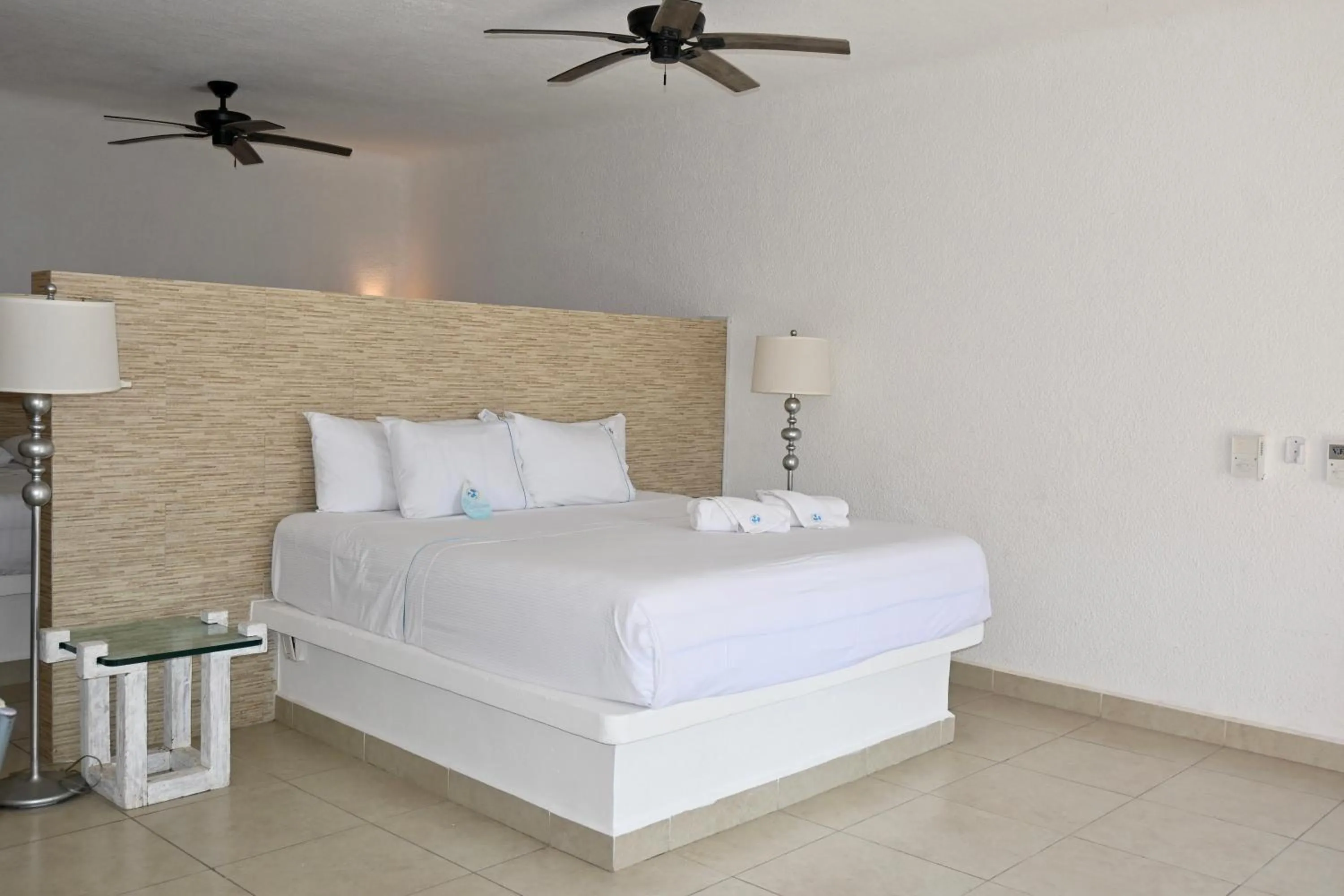 Bed in Pelicano Inn Playa del Carmen - Beachfront Hotel