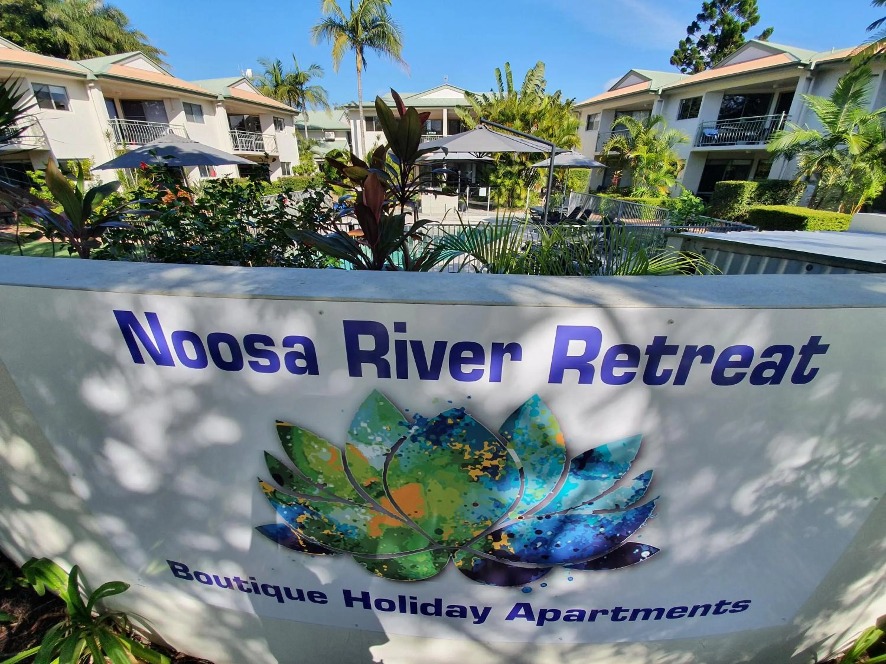 Property logo or sign in Noosa River Retreat Holiday Apartments