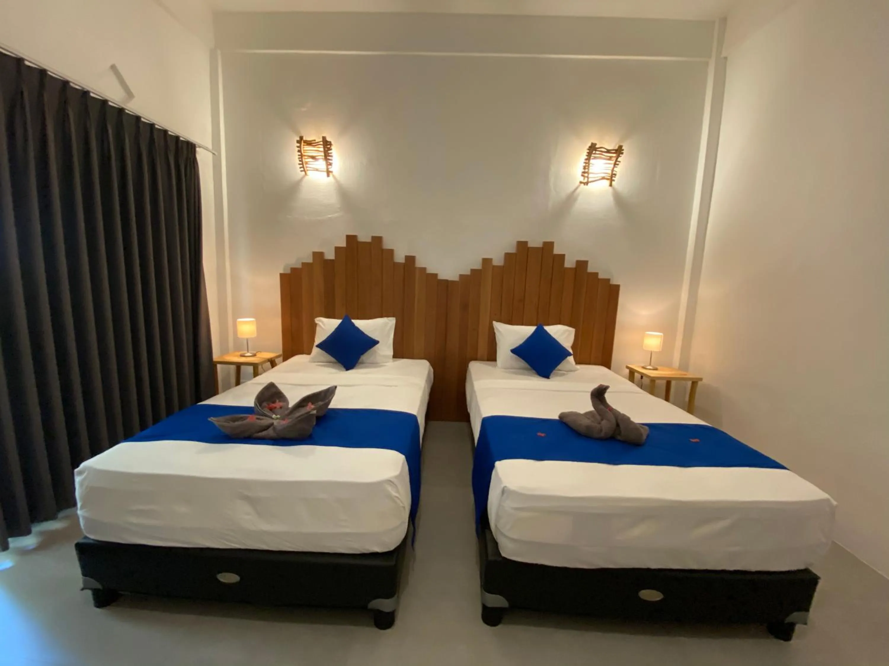 Bed in Living Trawangan Hotel