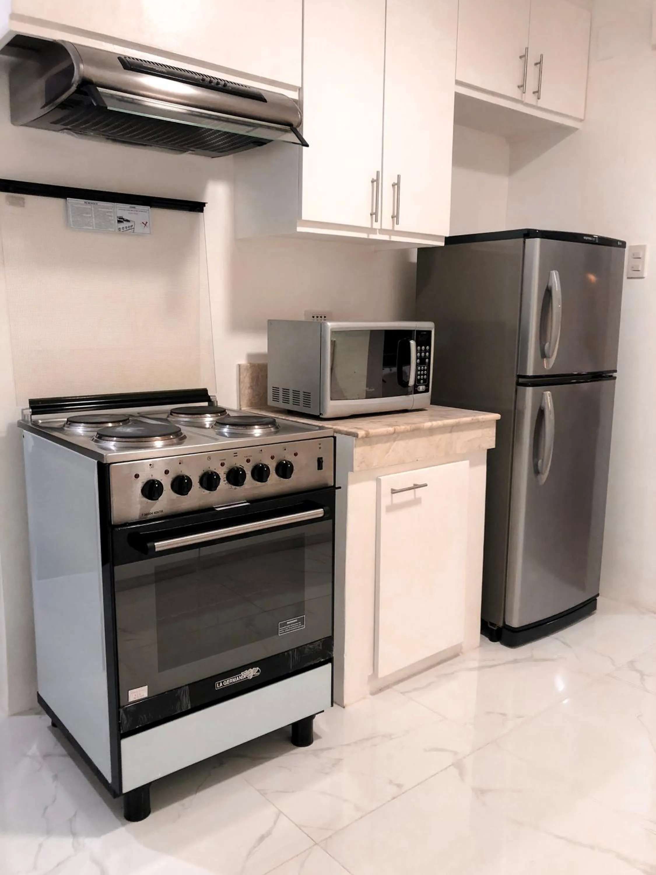 Kitchen or kitchenette in Parque España Residence Hotel