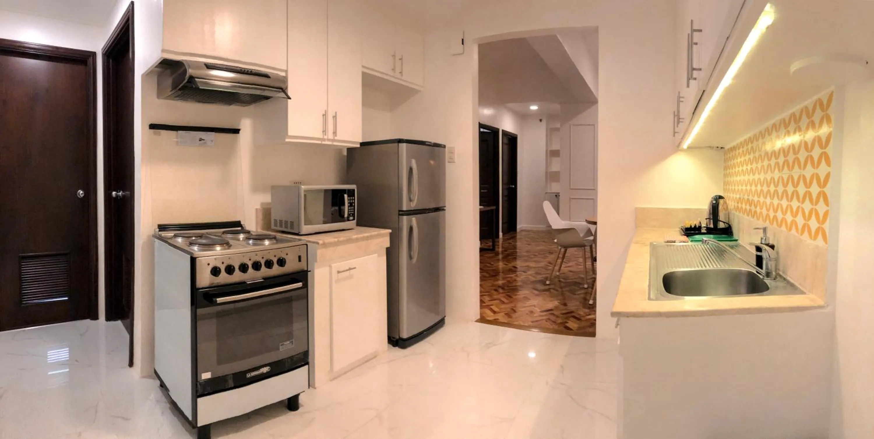 Kitchen or kitchenette in Parque España Residence Hotel