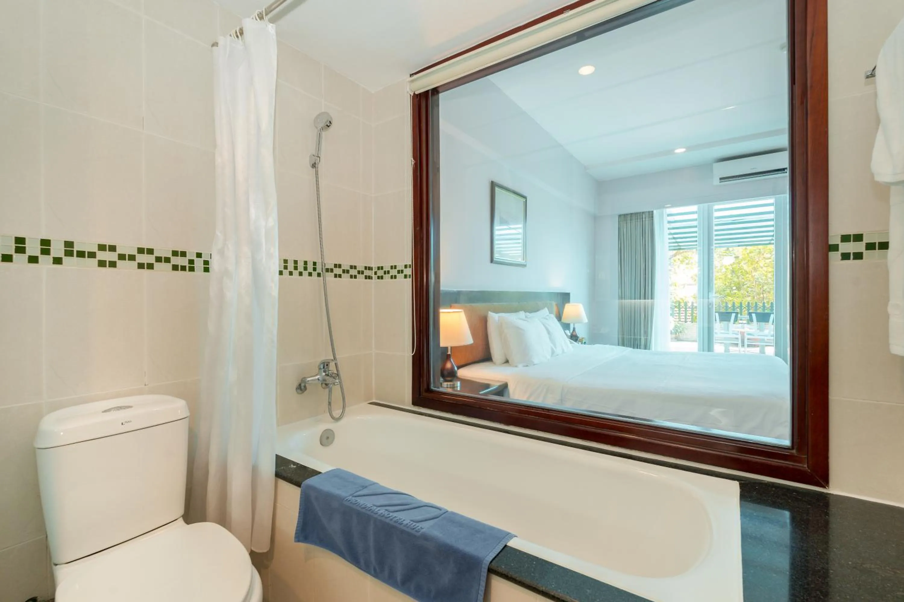 Toilet, Bed in Mondial Hotel Hue