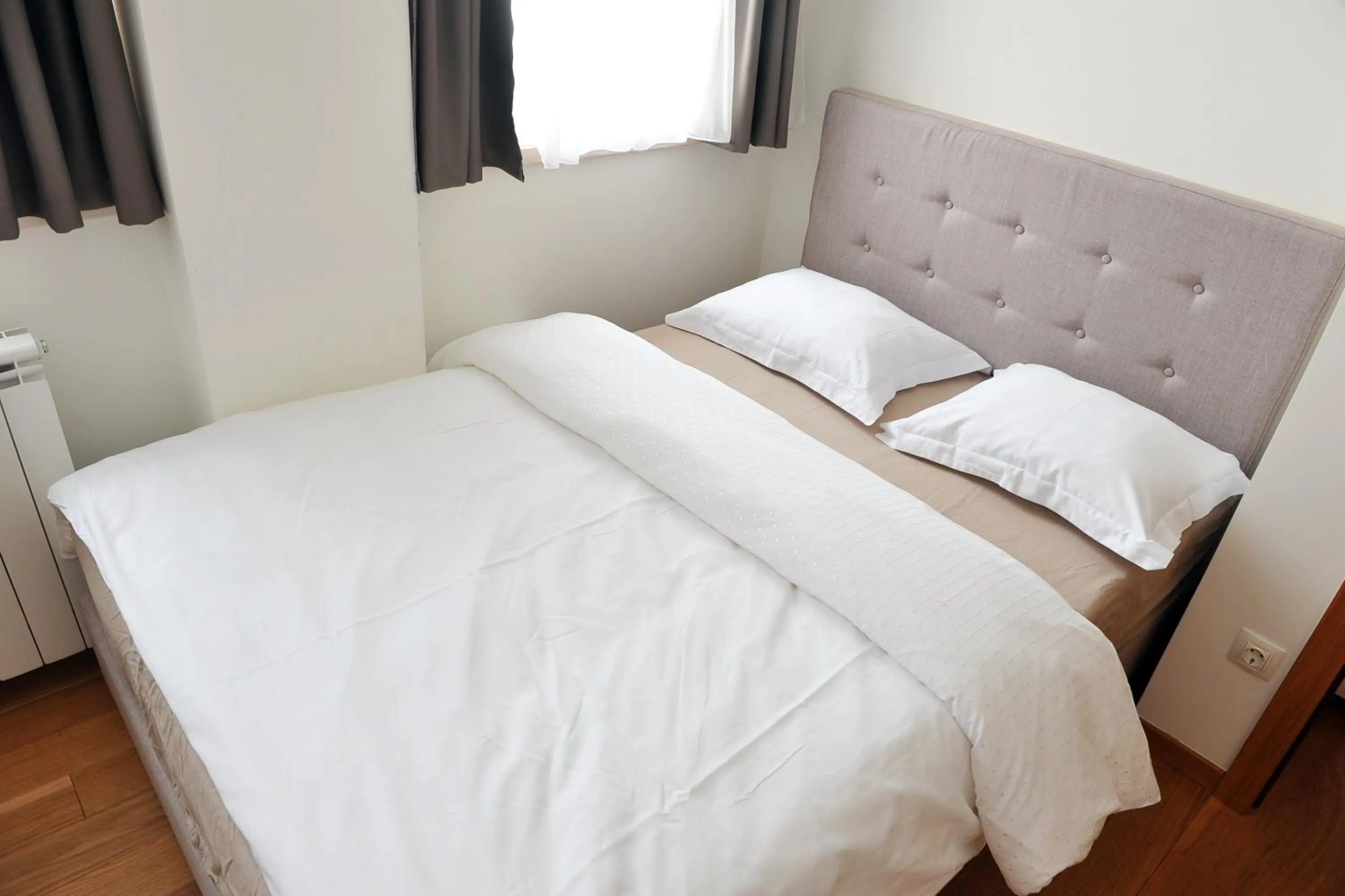 Bed in Vila Apartments Wellness&Spa