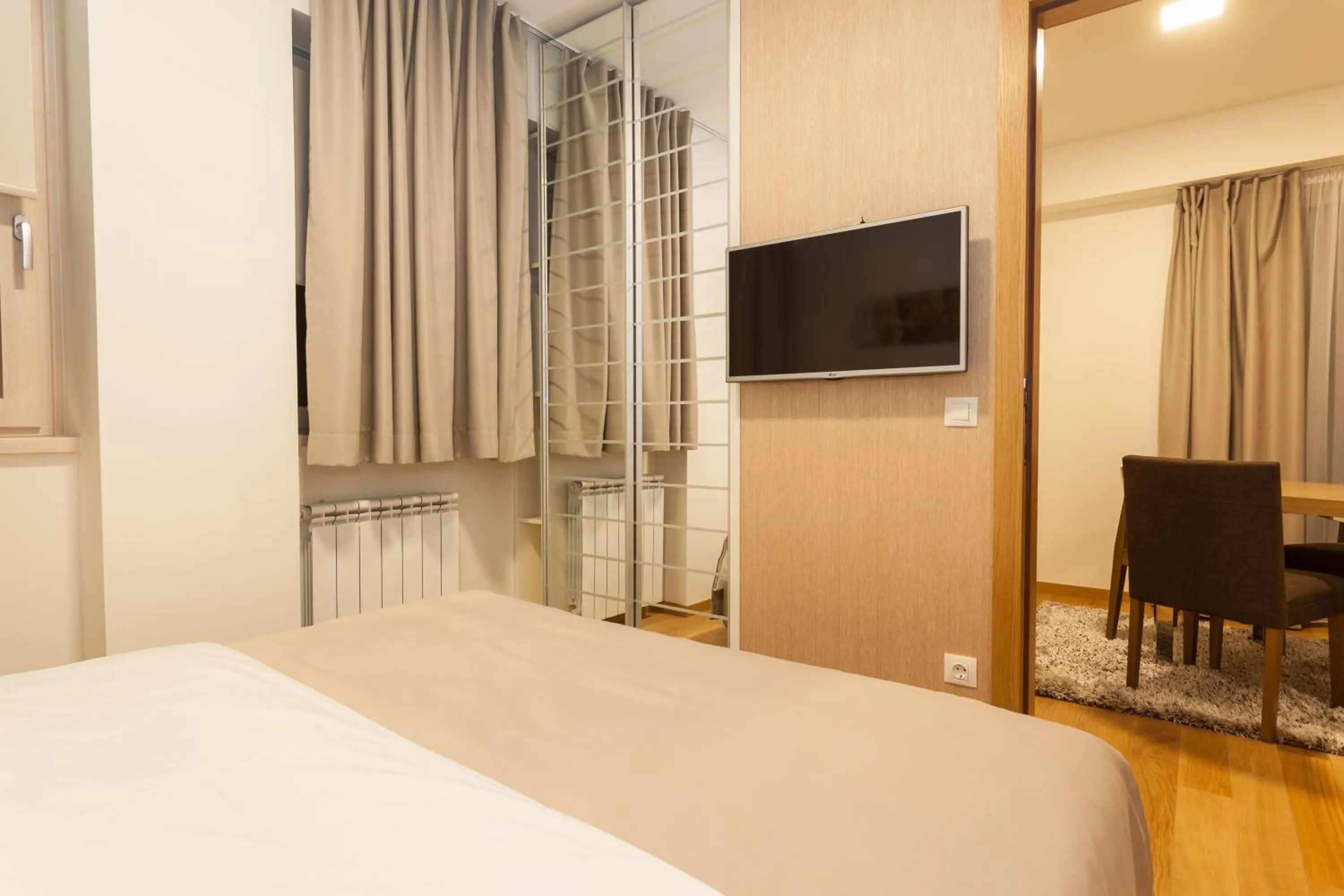 Bed in Vila Apartments Wellness&Spa
