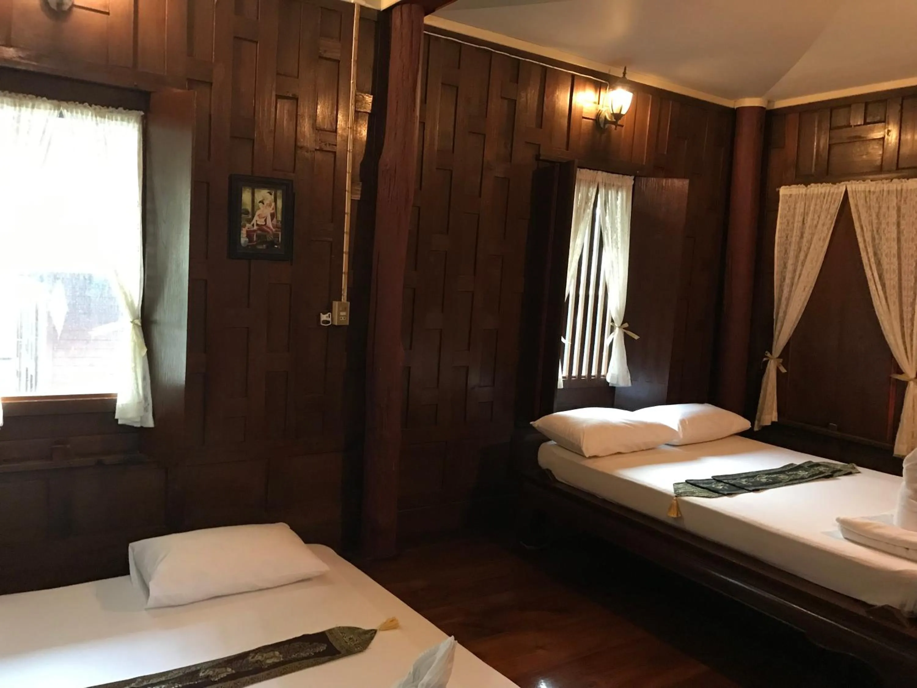 Bed in บ้านกรนรา Baan Kornnara