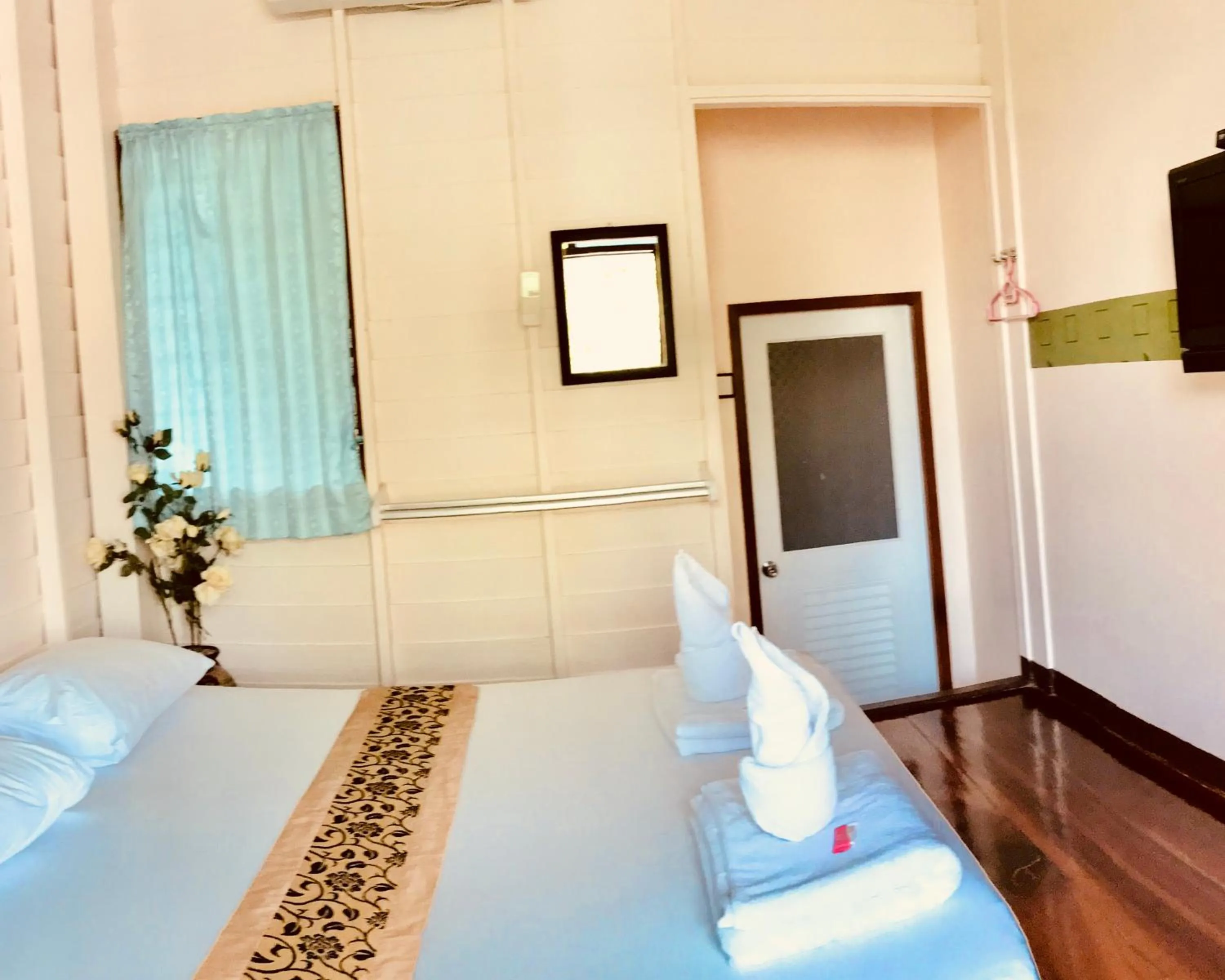 Bed in บ้านกรนรา Baan Kornnara