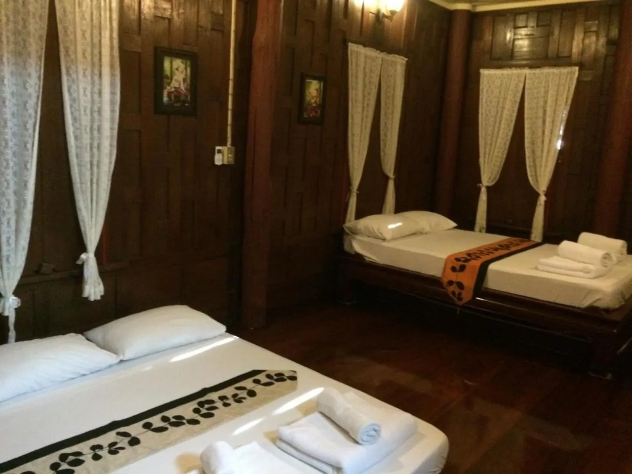 Bed in บ้านกรนรา Baan Kornnara