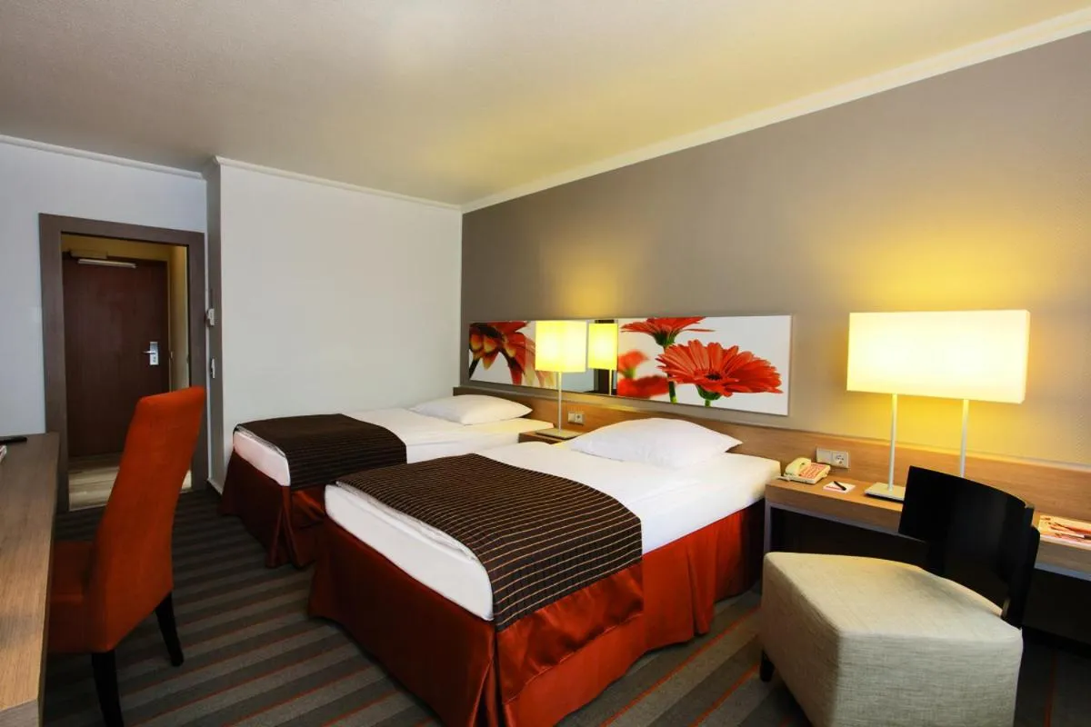 Bed in SOALTEE Hotel by Trip Inn Frankfurt Messe Tagungshotel