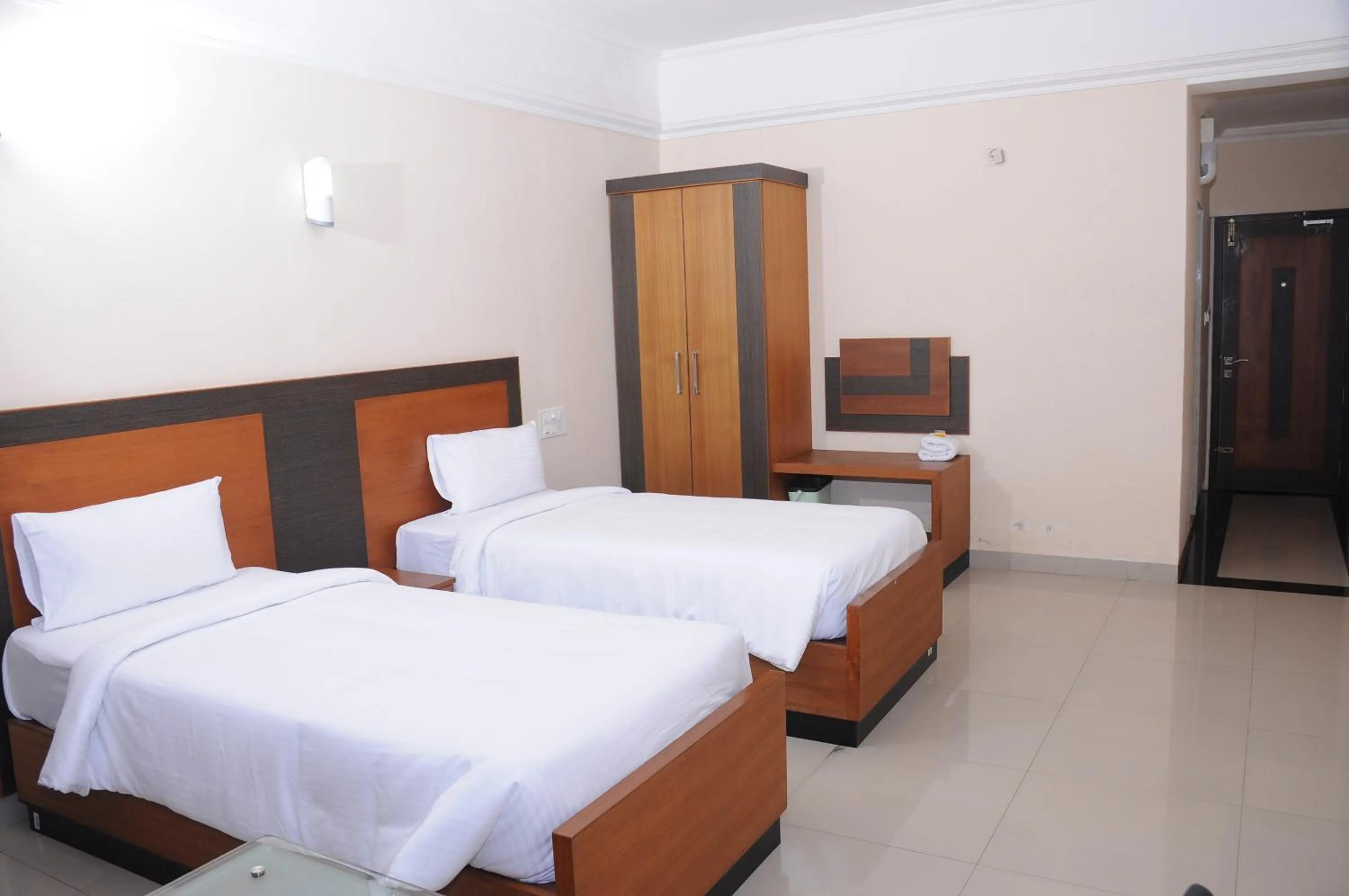 Bed in Alhind Calicut Tower