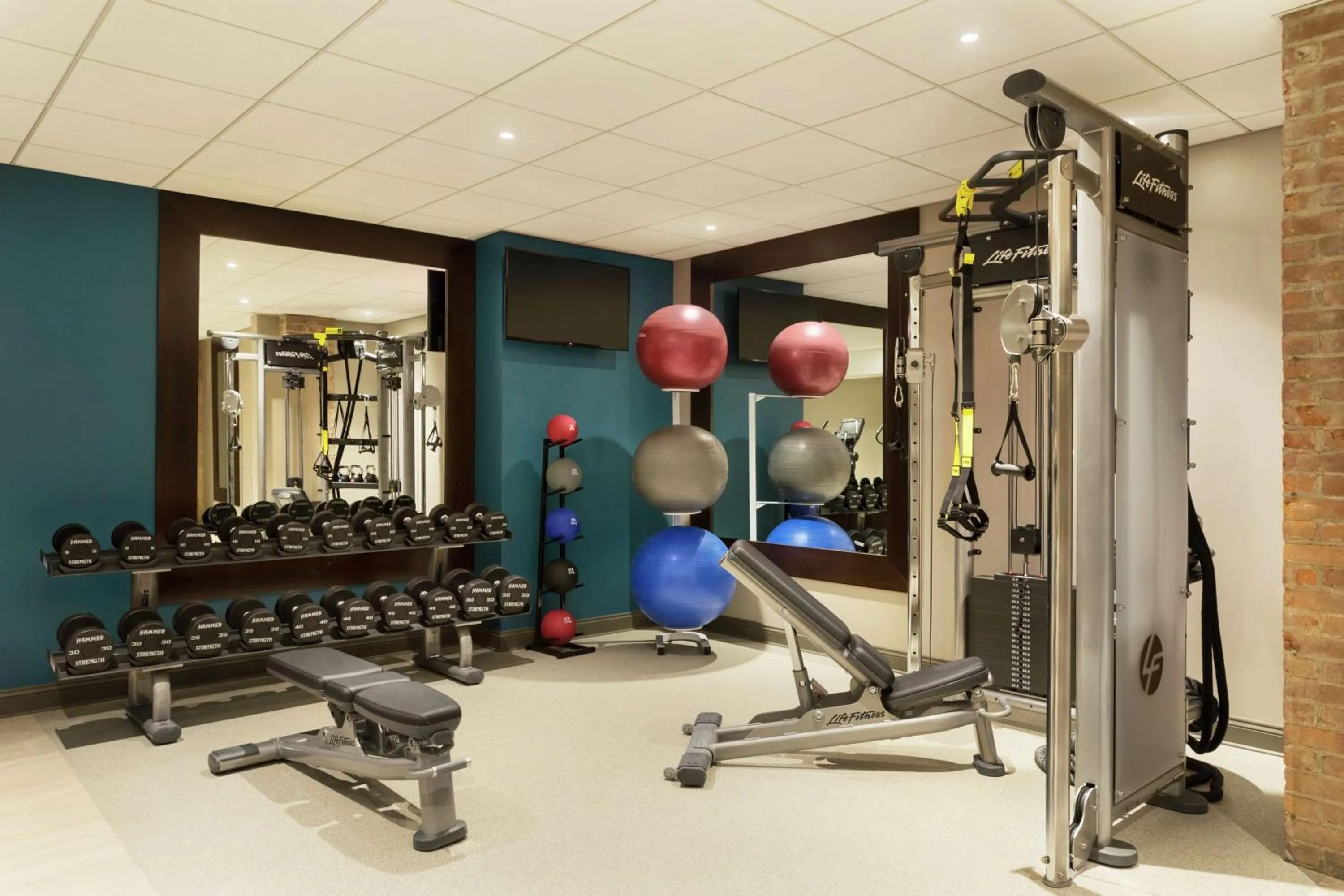 Fitness centre/facilities in Hotel Saranac, Curio Collection By Hilton