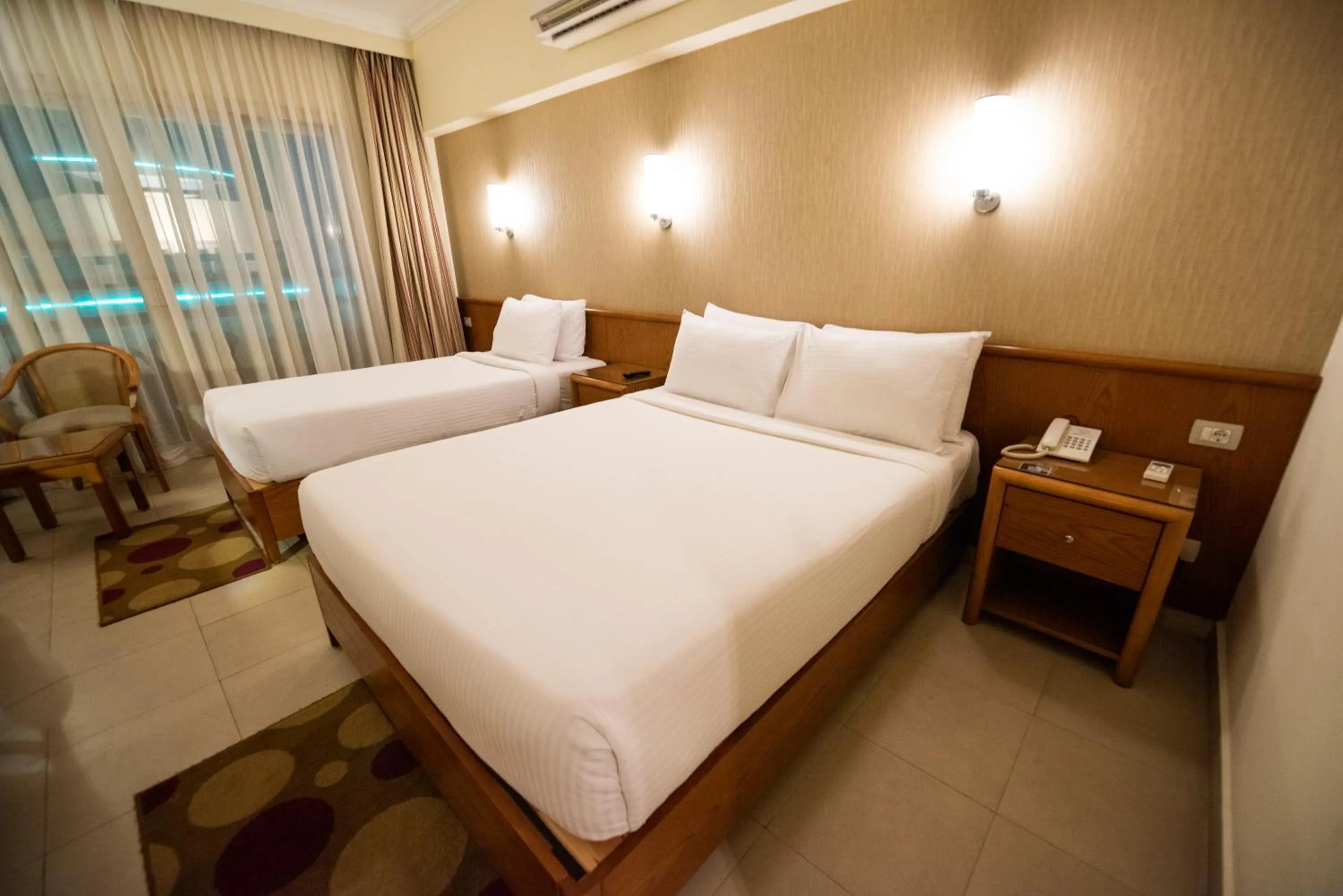 Bed in The Grand Plaza Hotel Smouha