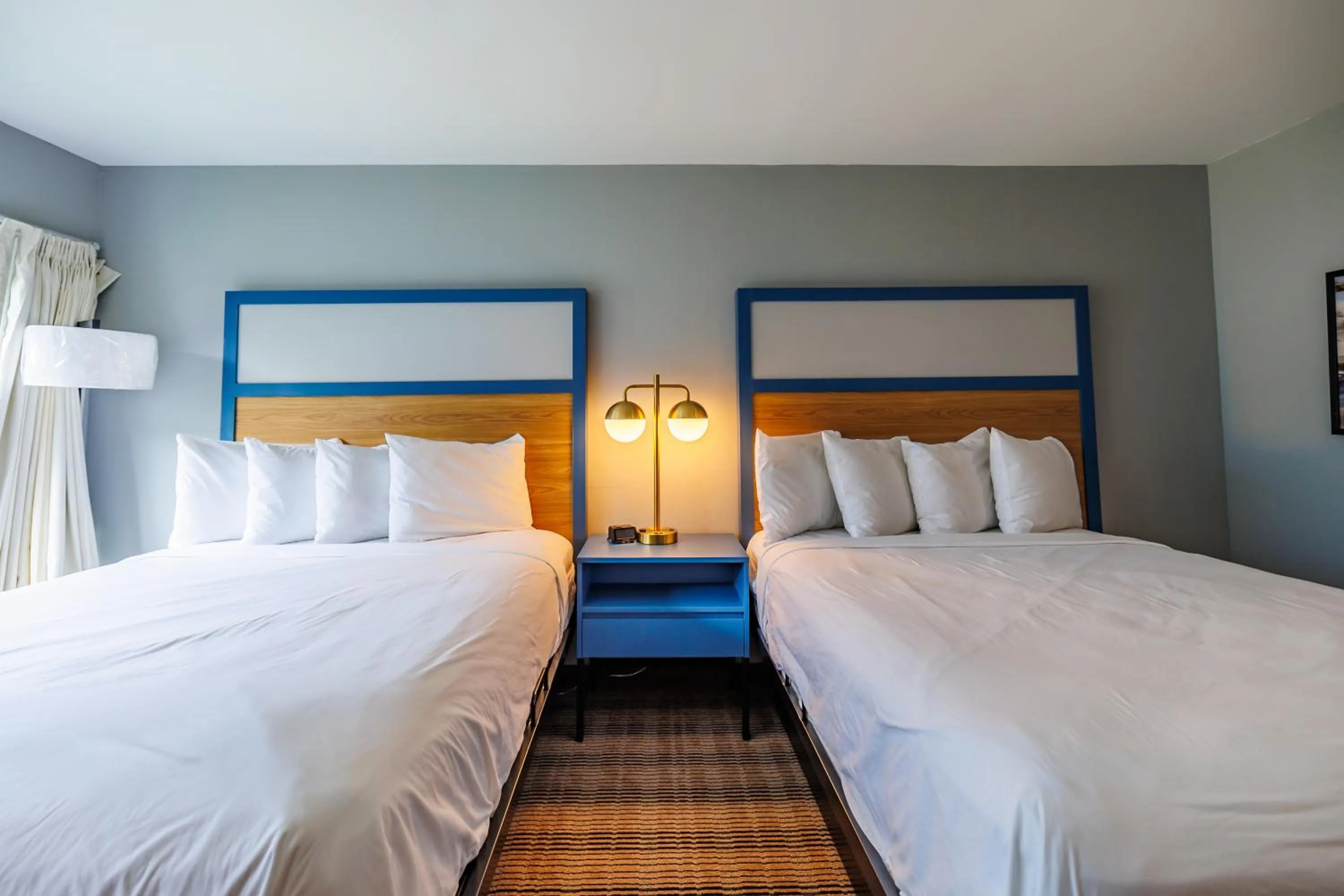 Bed in AmericInn by Wyndham Omaha Near Zoo