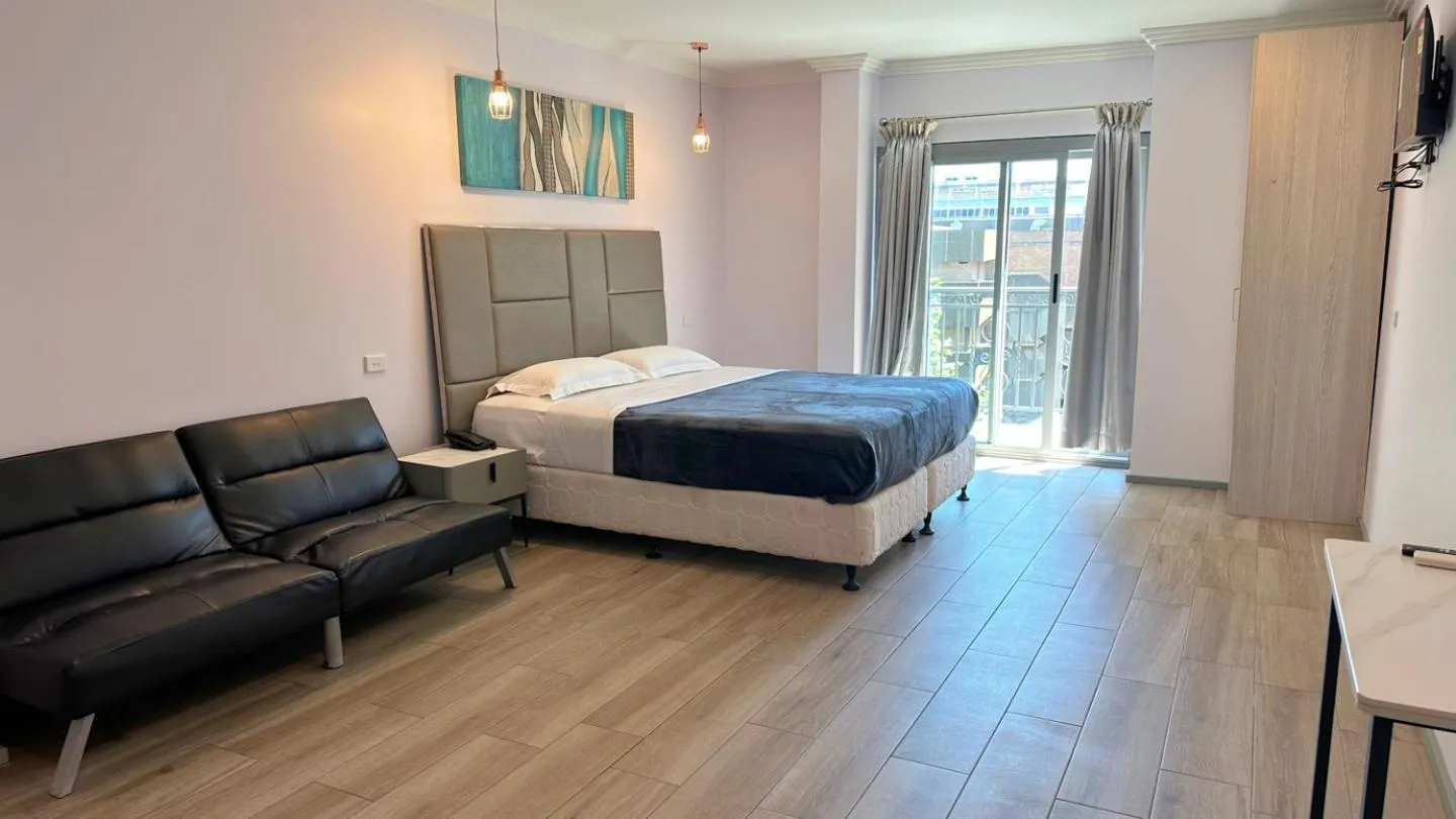 Bed in Sydney RiseOn Hotel