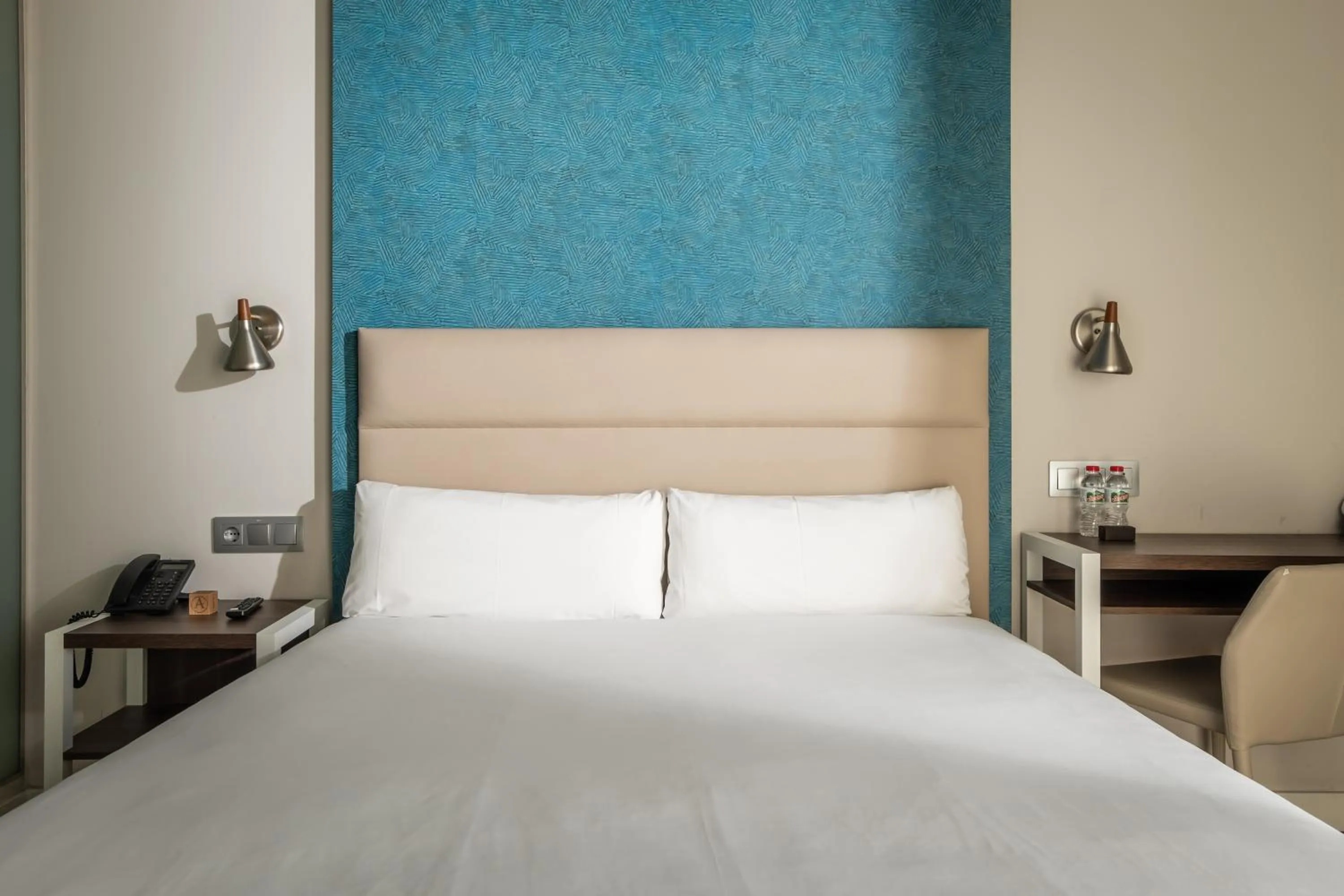 Bed in Arya Stadium Hotel