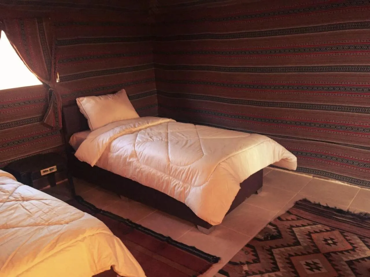 Bed in Beyond Wadi Rum Camp