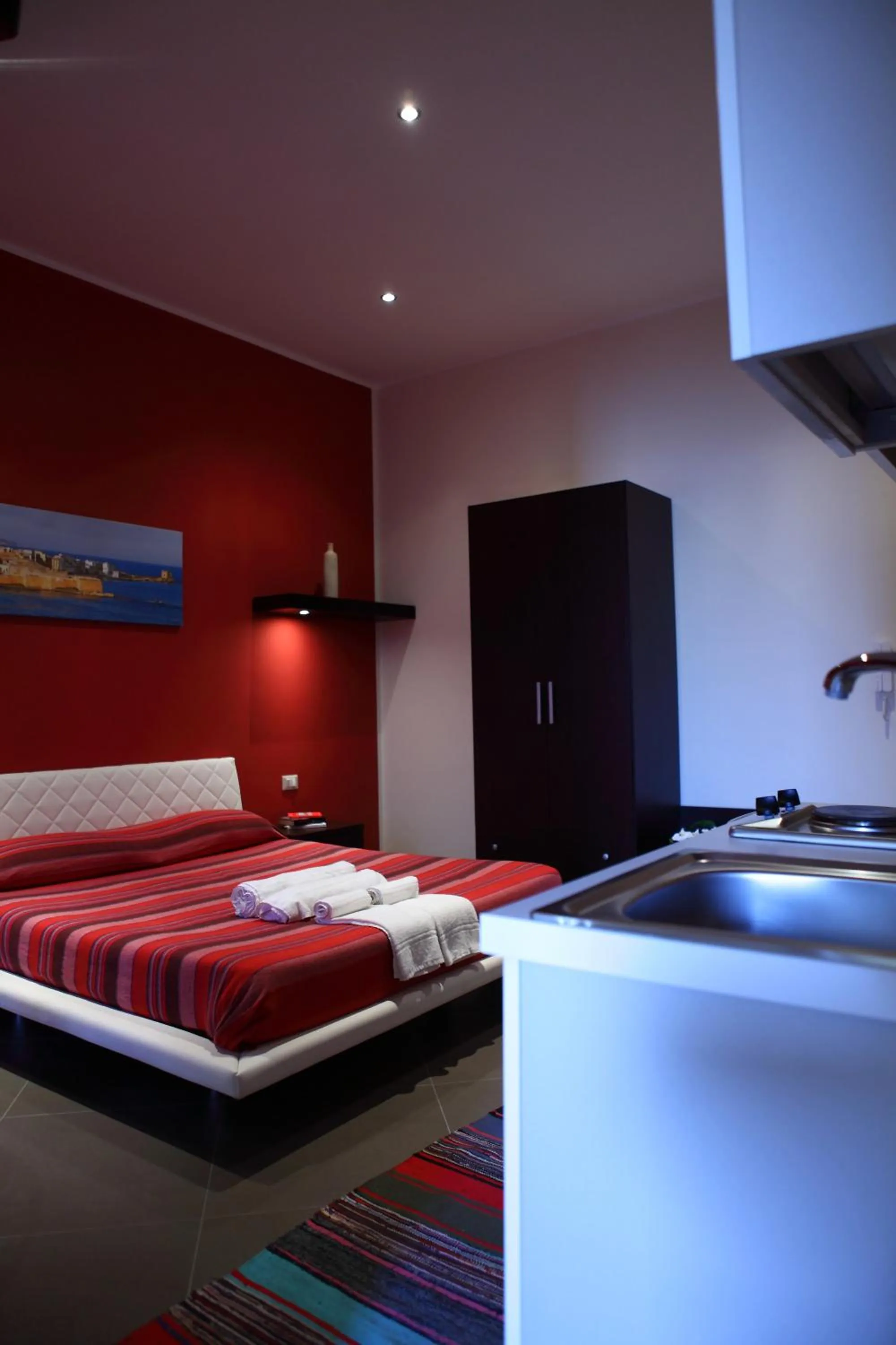 Kitchen or kitchenette, Bed in Palazzo Dei Corsari