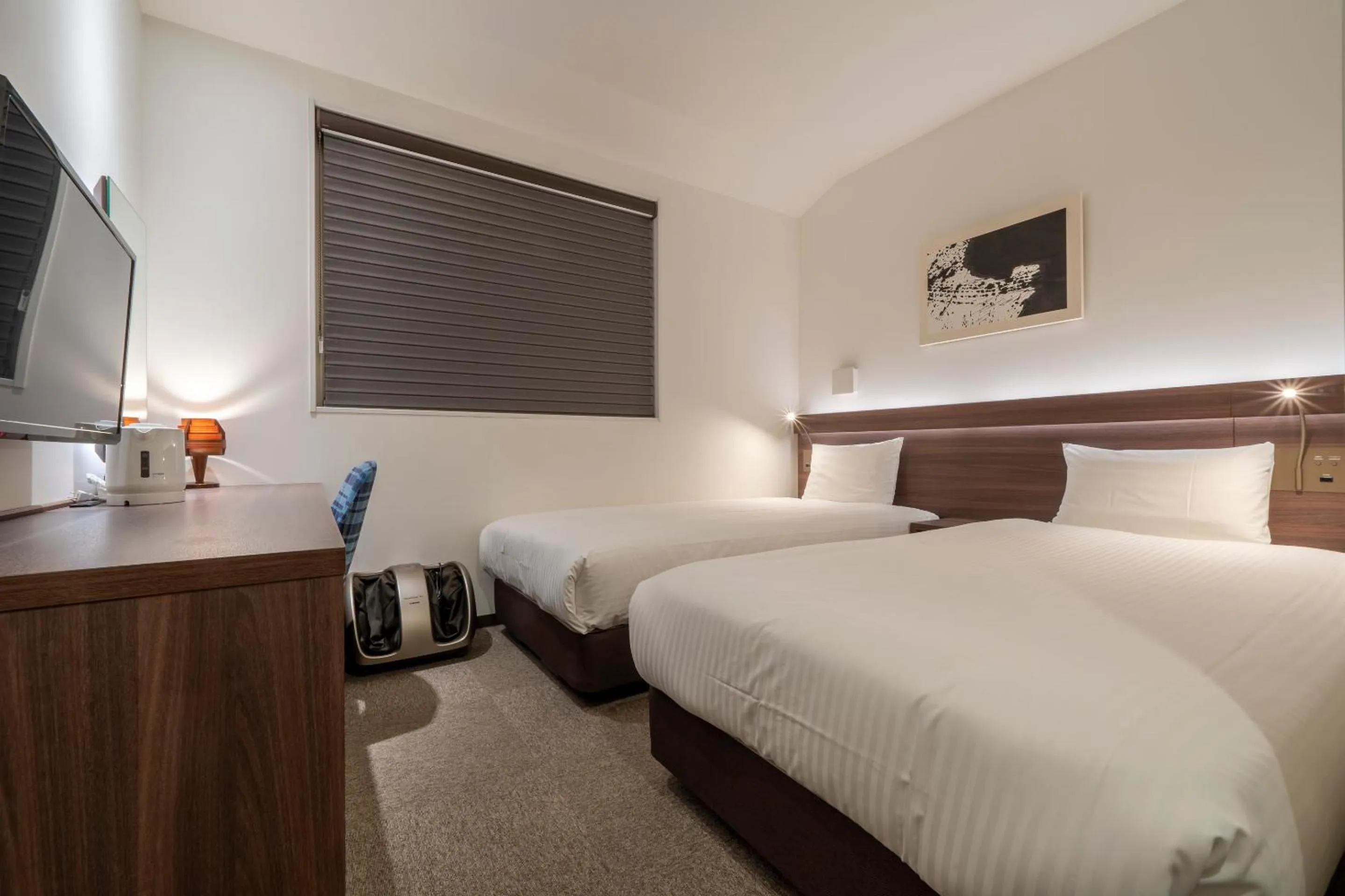 Bed in RESI STAY Jisco Hotel Kyoto Goshonishi