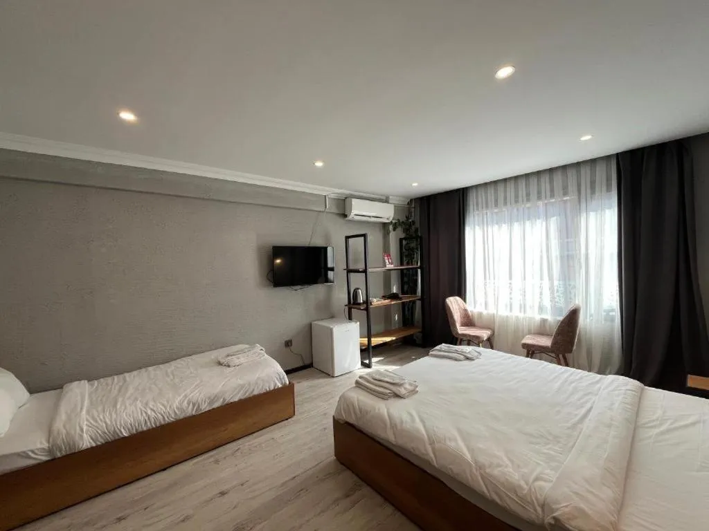 Bed in Le Safran Suite Hotel