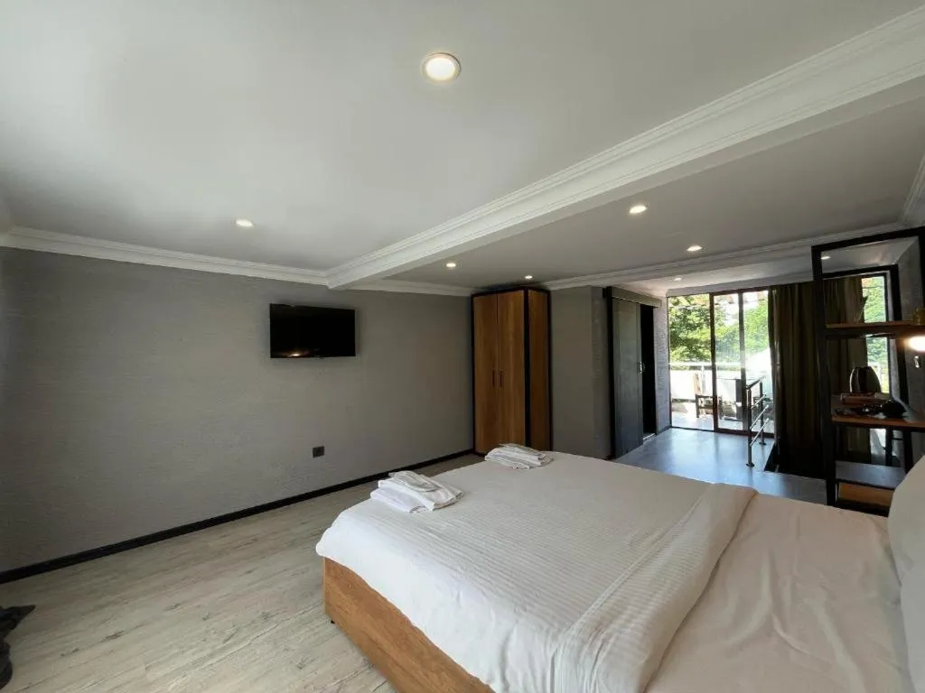 Bed in Le Safran Suite Hotel