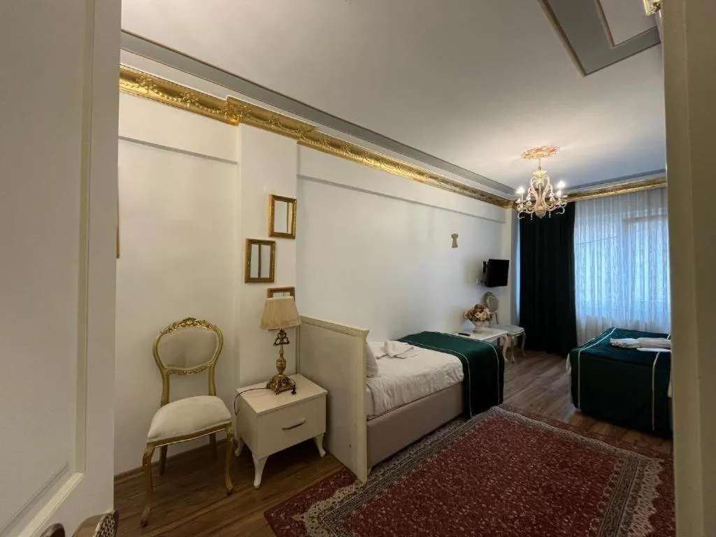 Bed in Le Safran Suite Hotel