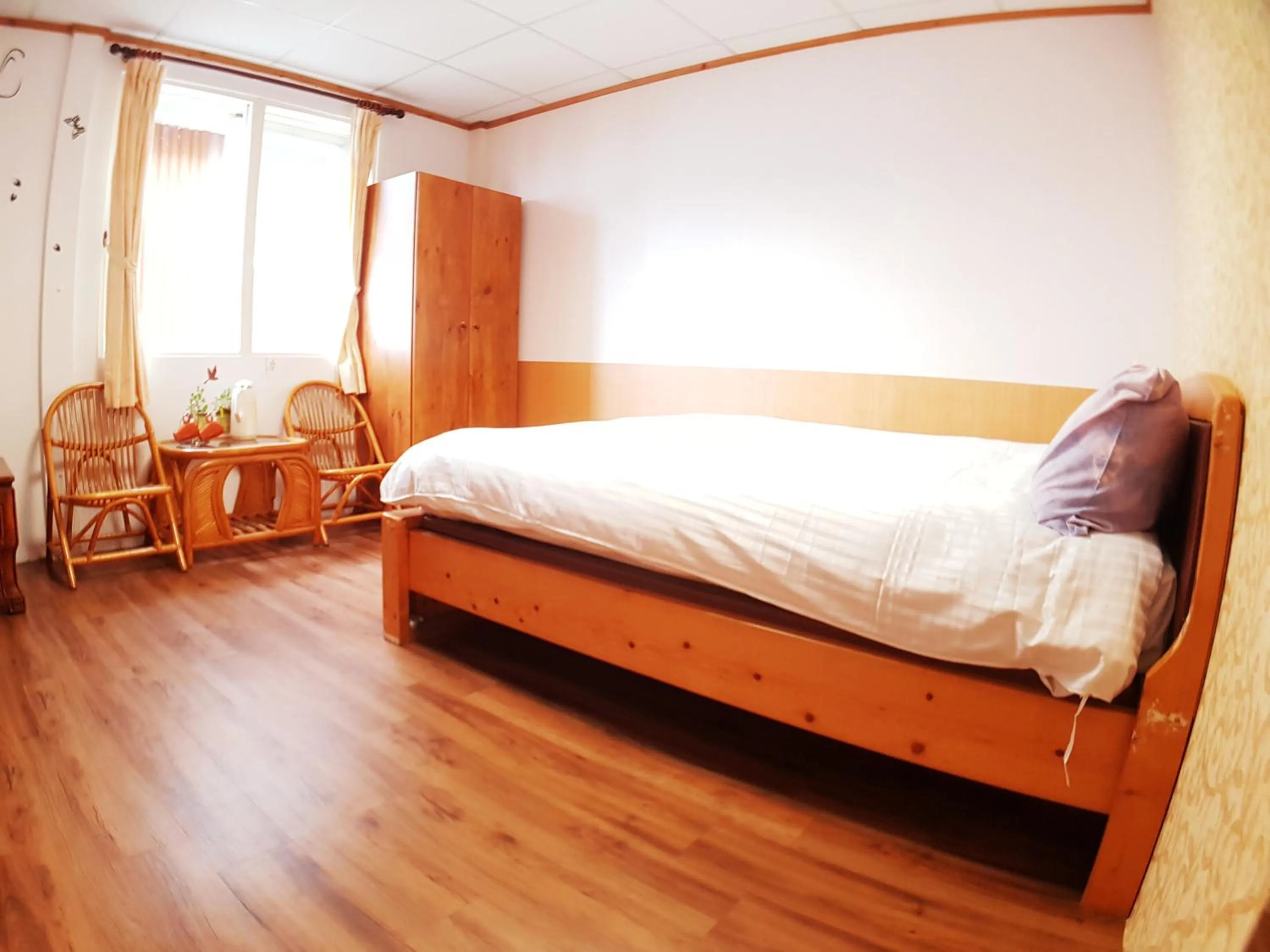 Bed in Shan Shui-Yuan Vege Guest House
