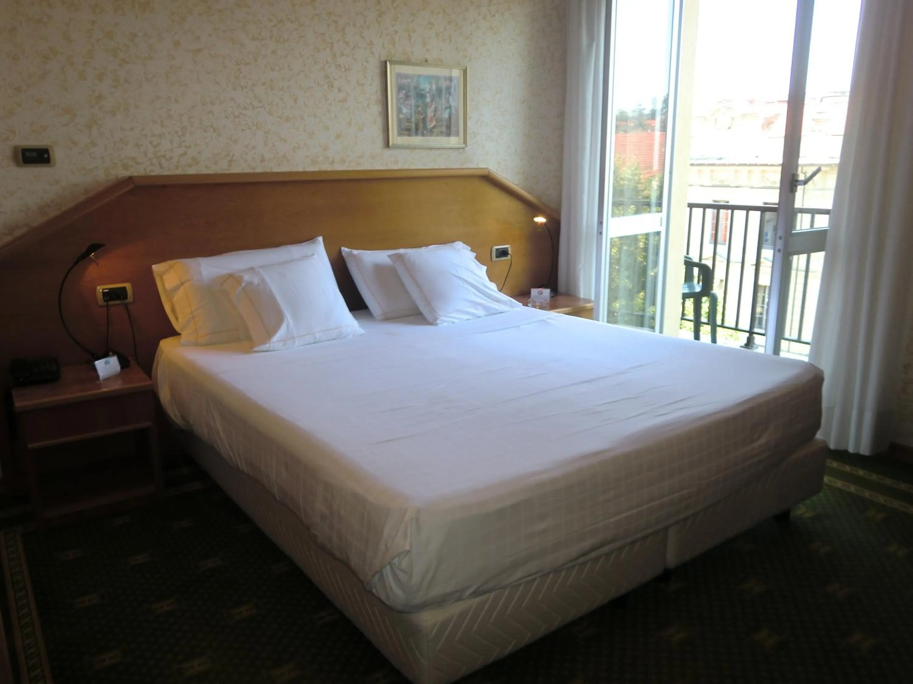Bed in Hotel Ariston